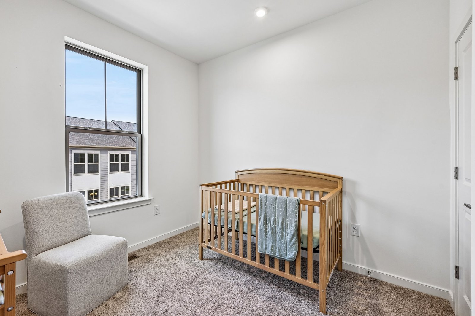 secondary bedroom with a crib