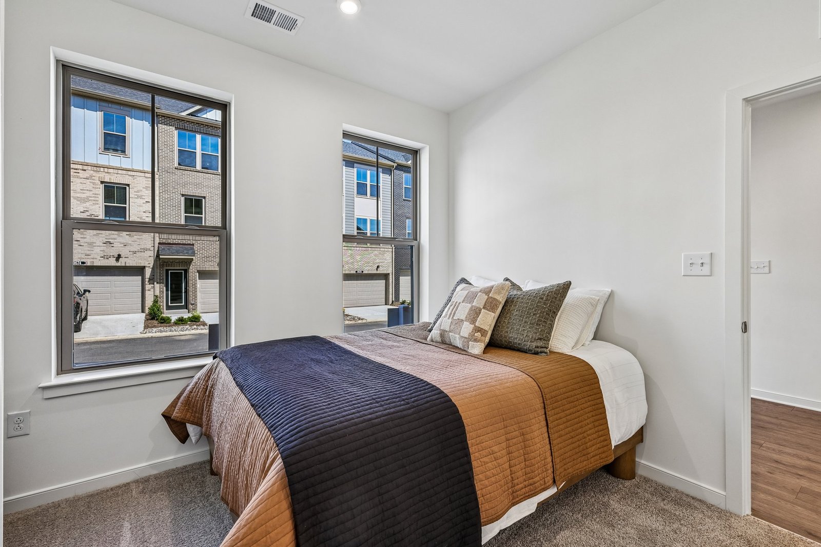 secondary bedroom with two windows