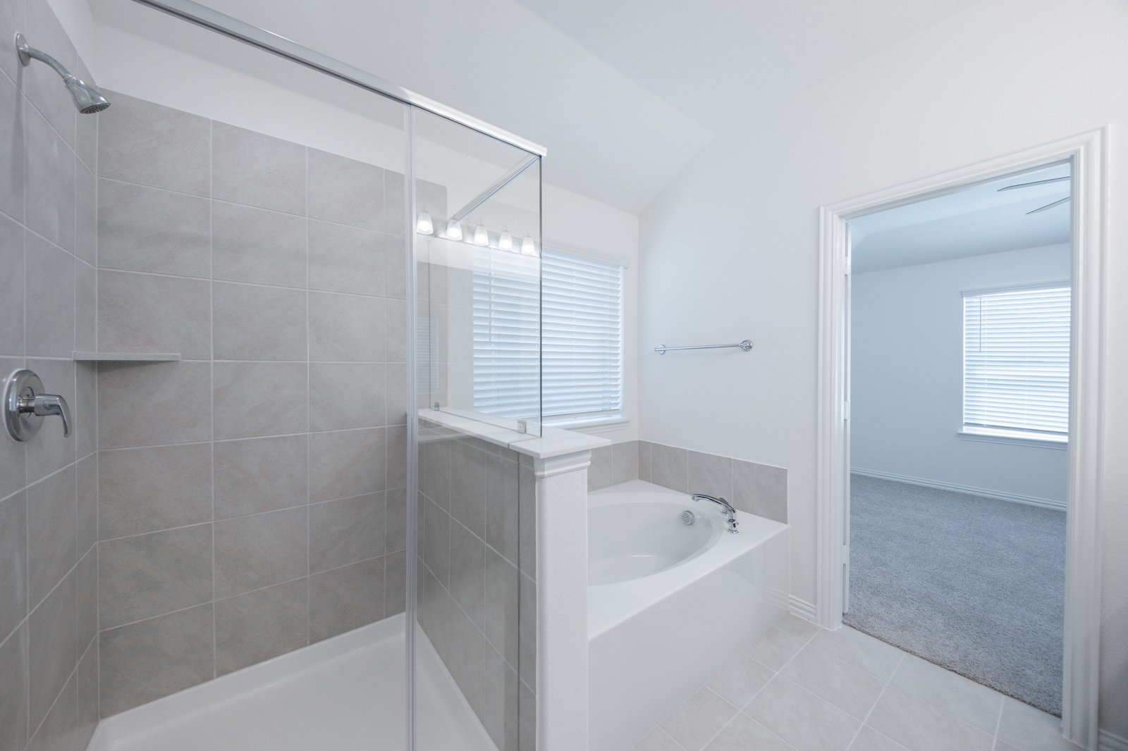 primary bathroom with soaking tub and walk-in shower