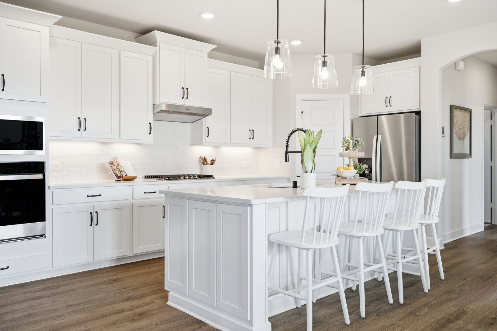 open kitchen with white cabinetry