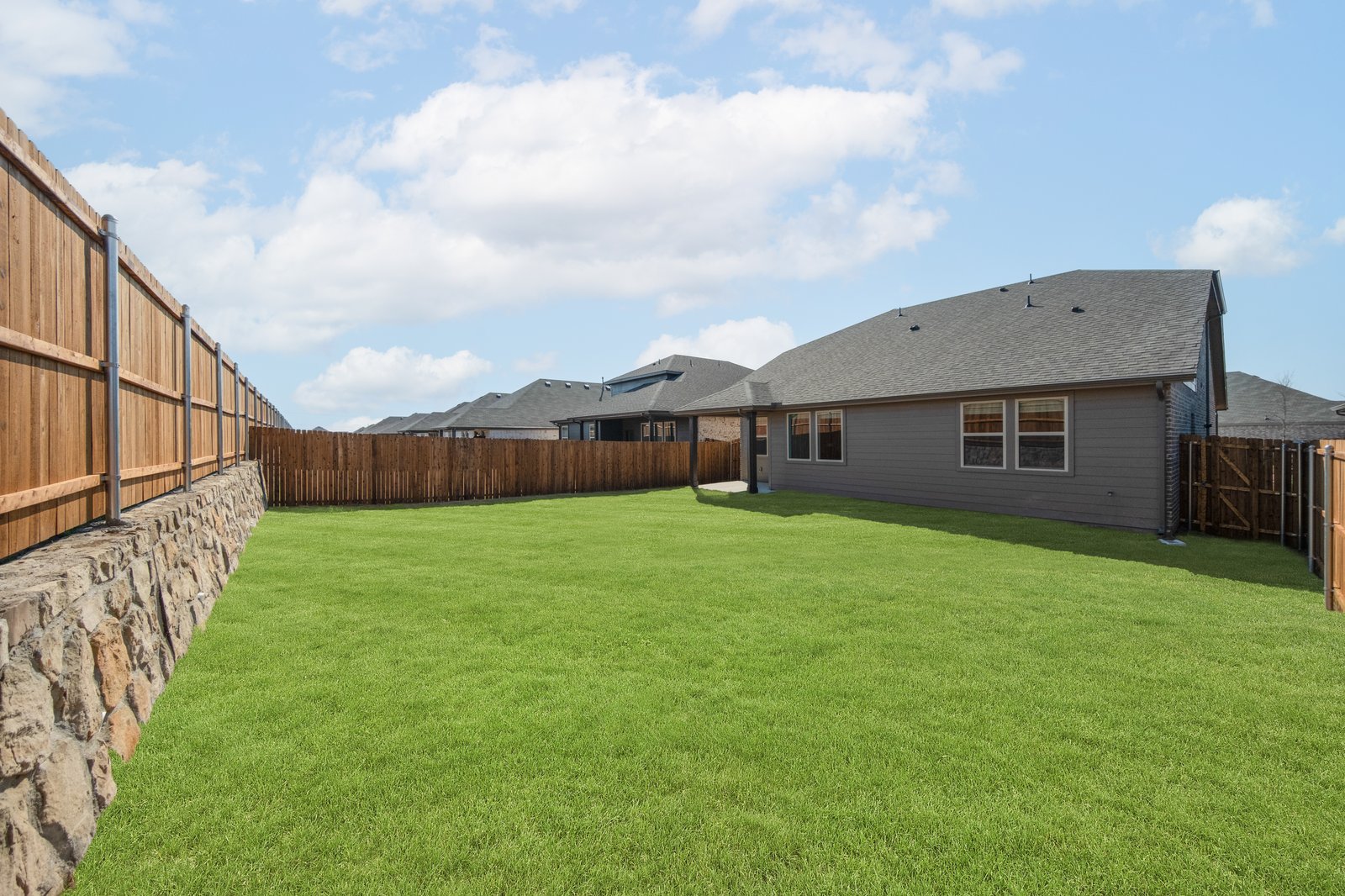 backyard with grass and covered patio