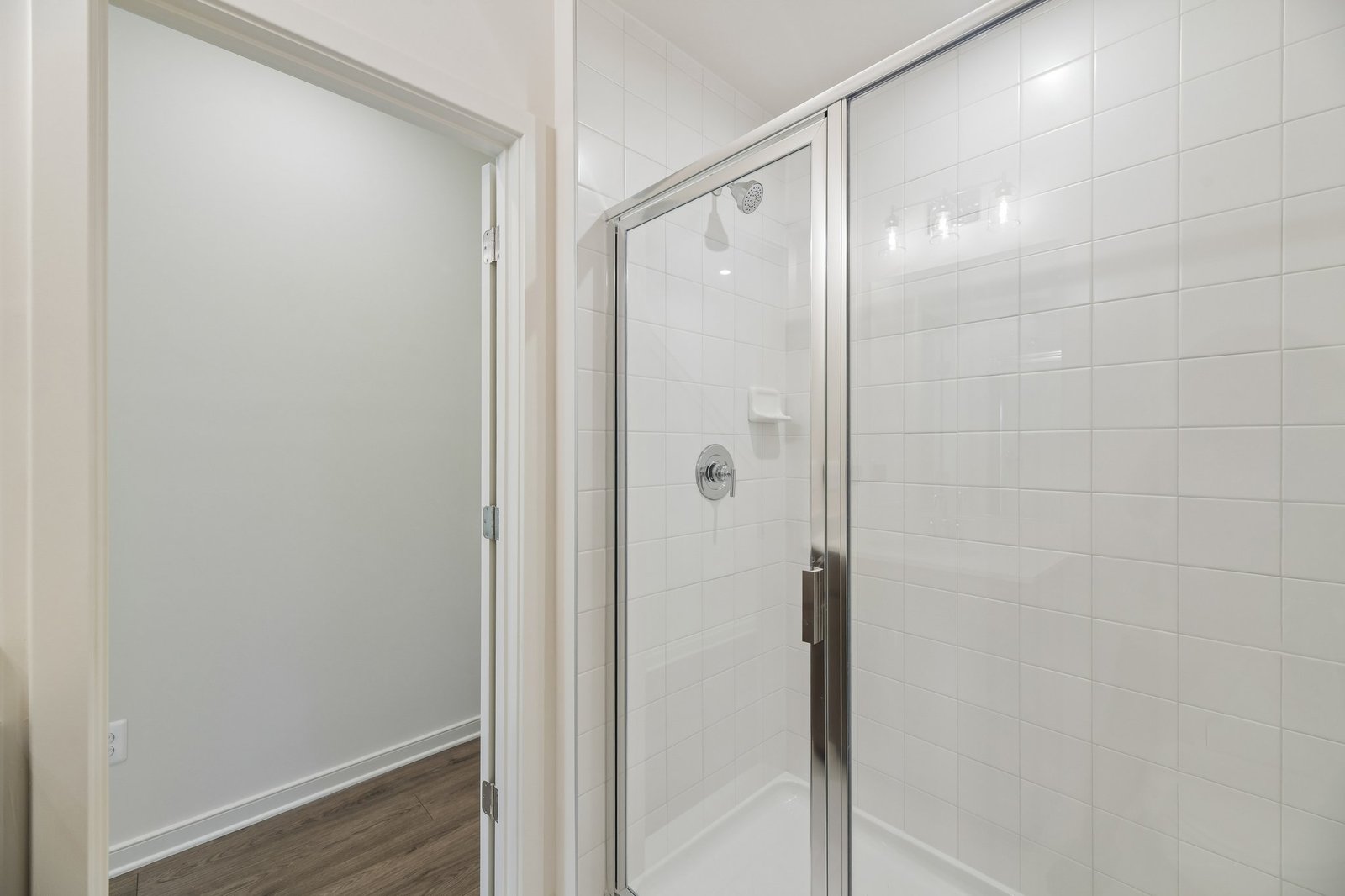 secondary bathroom with a walk-in shower