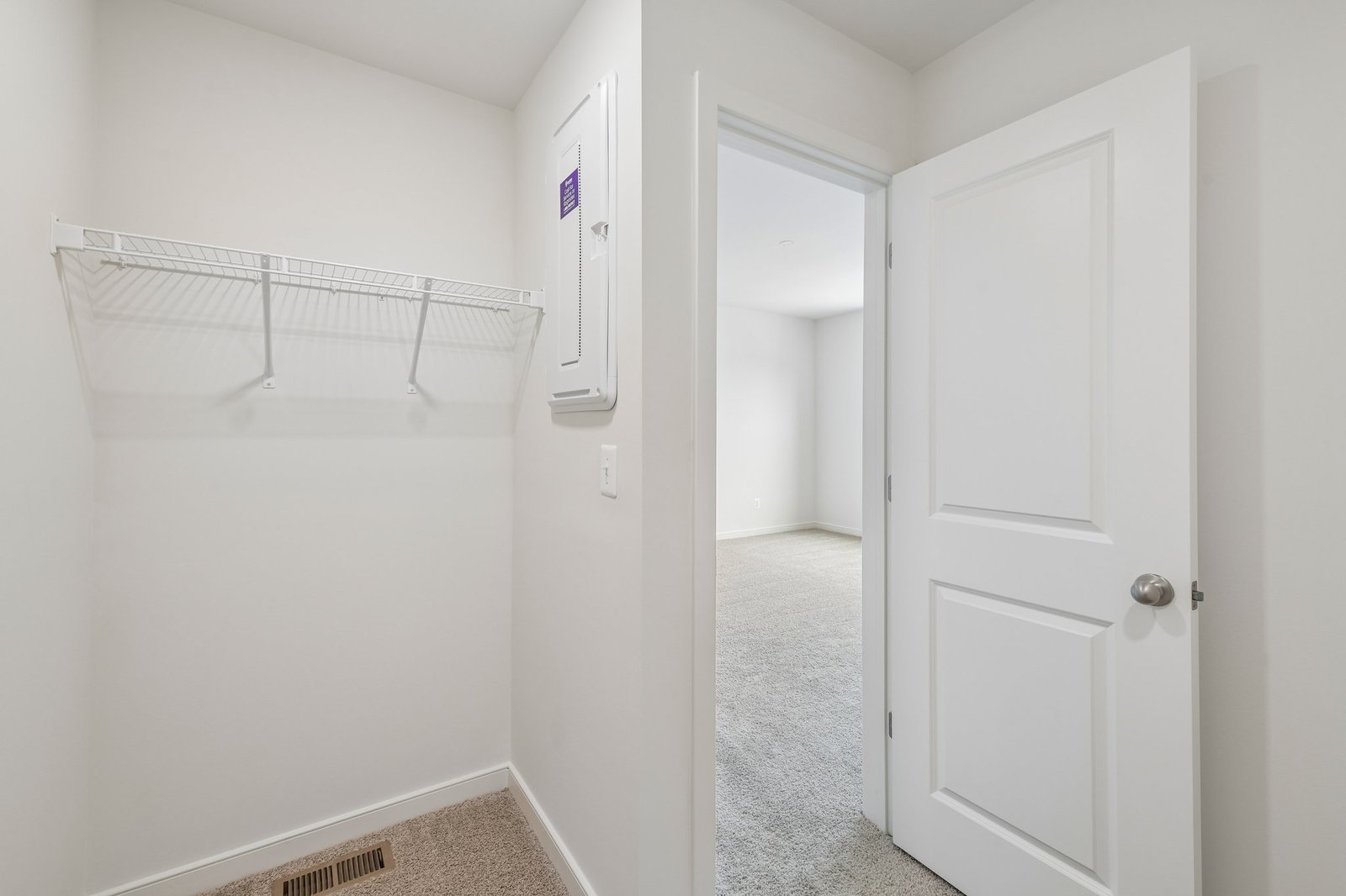 primary walk-in closet with wire shelving