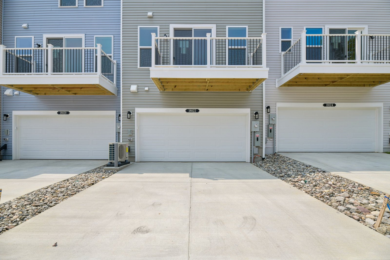 three-story townhome with a 2-car garage