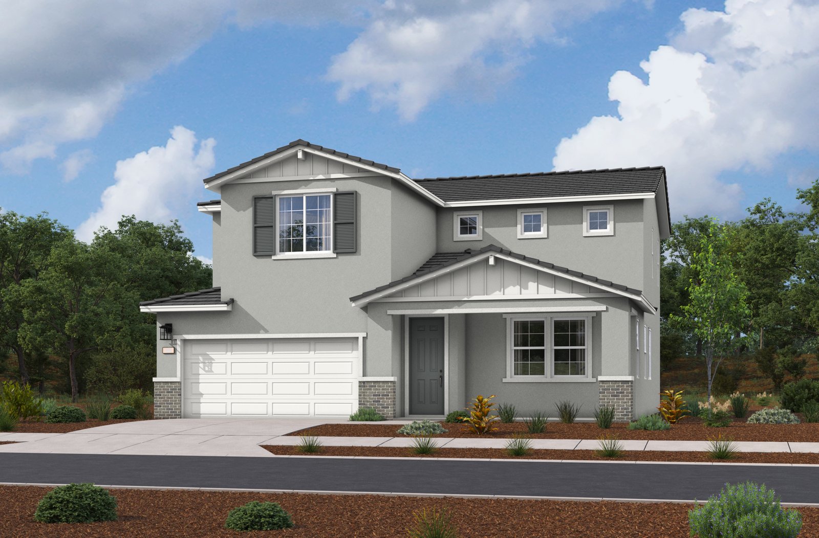 exterior of two-story home with neutral paint and desert landscaping