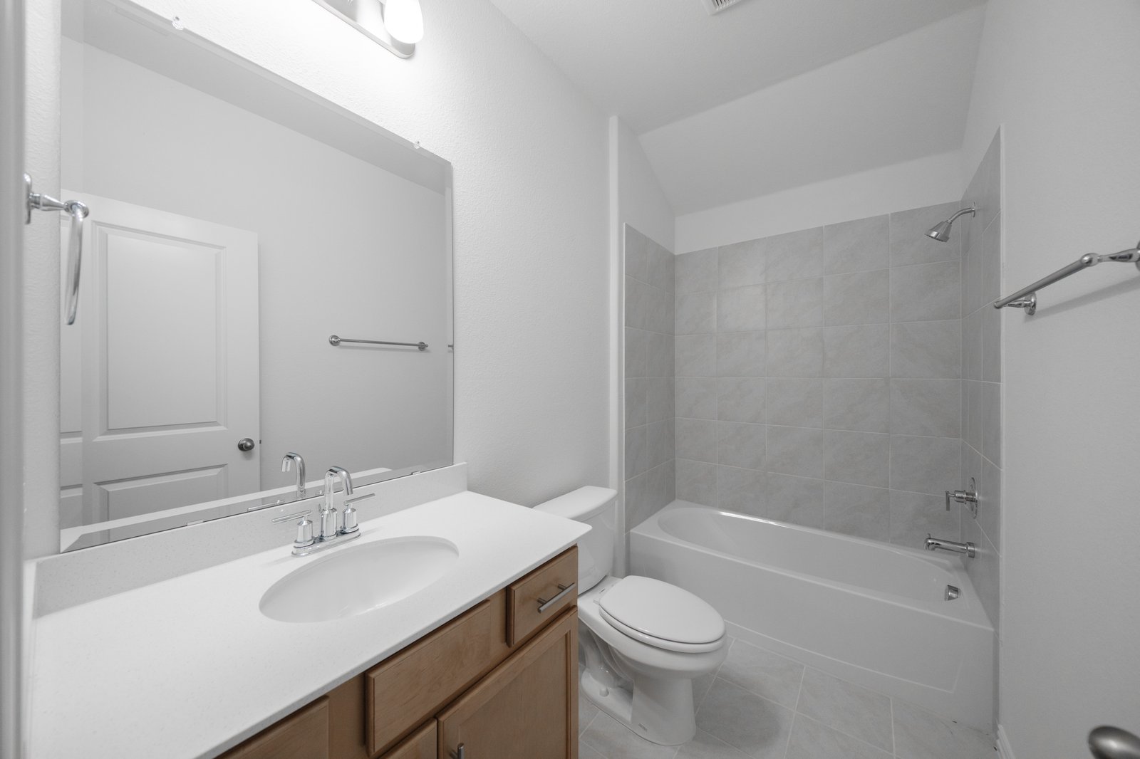bathroom with tub and tile