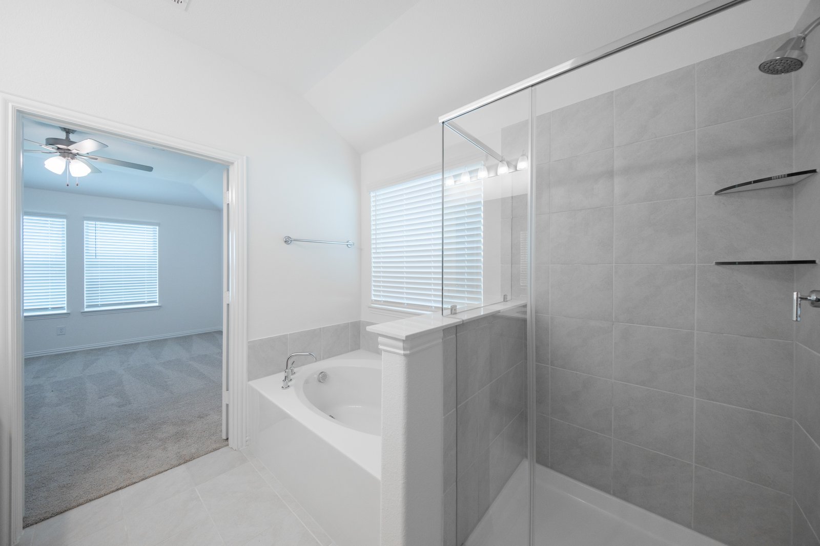 bathroom with tub and shower