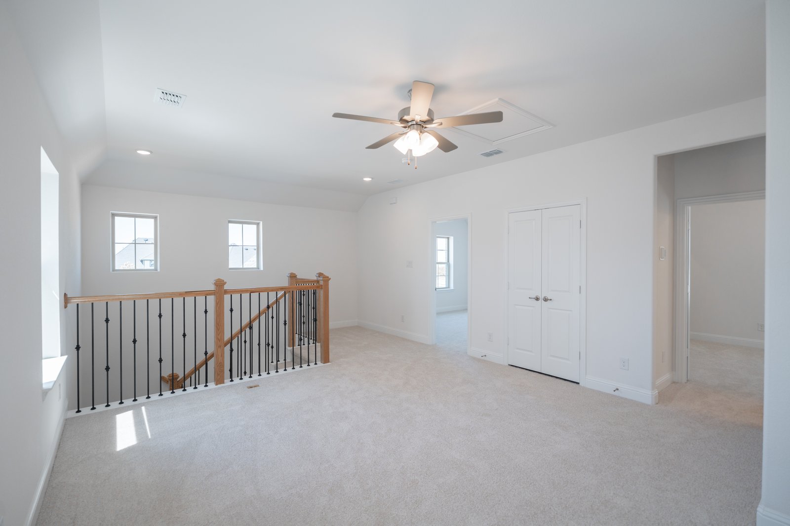 open gameroom with carpet and ceiling fan