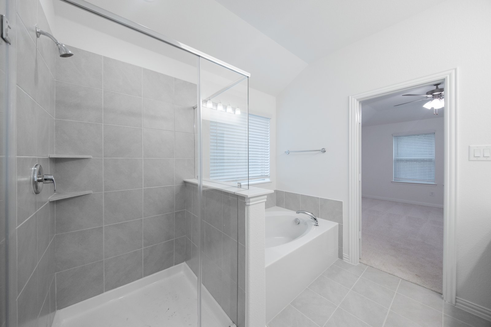 primary bathroom with soaking tub and walk-in shower