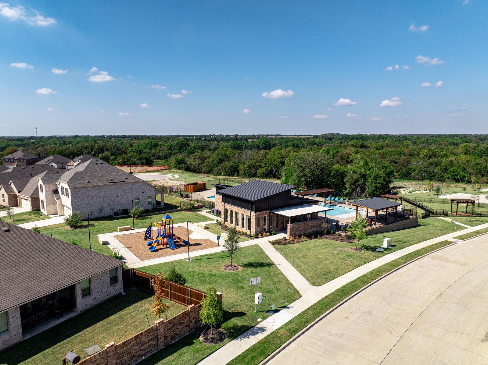 view of amenity center and playground