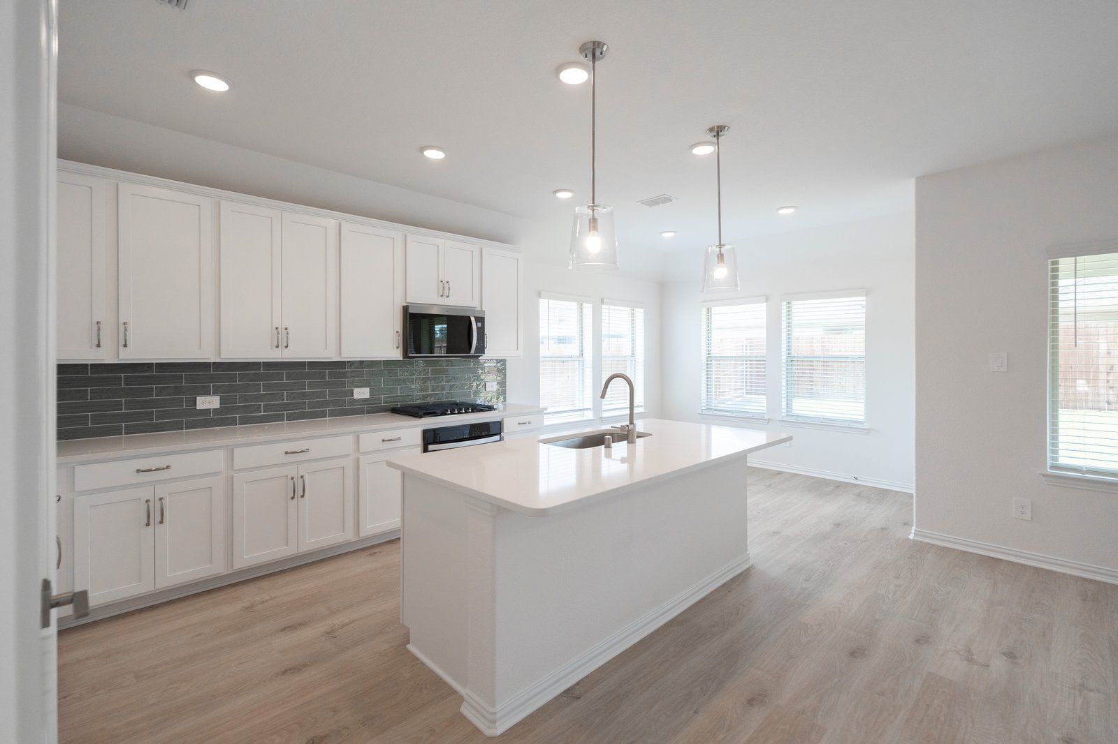kitchen with white cabinets and countertops