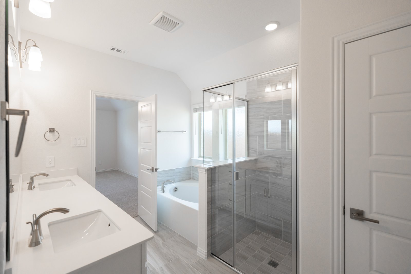 bathroom with walk-in shower and tub