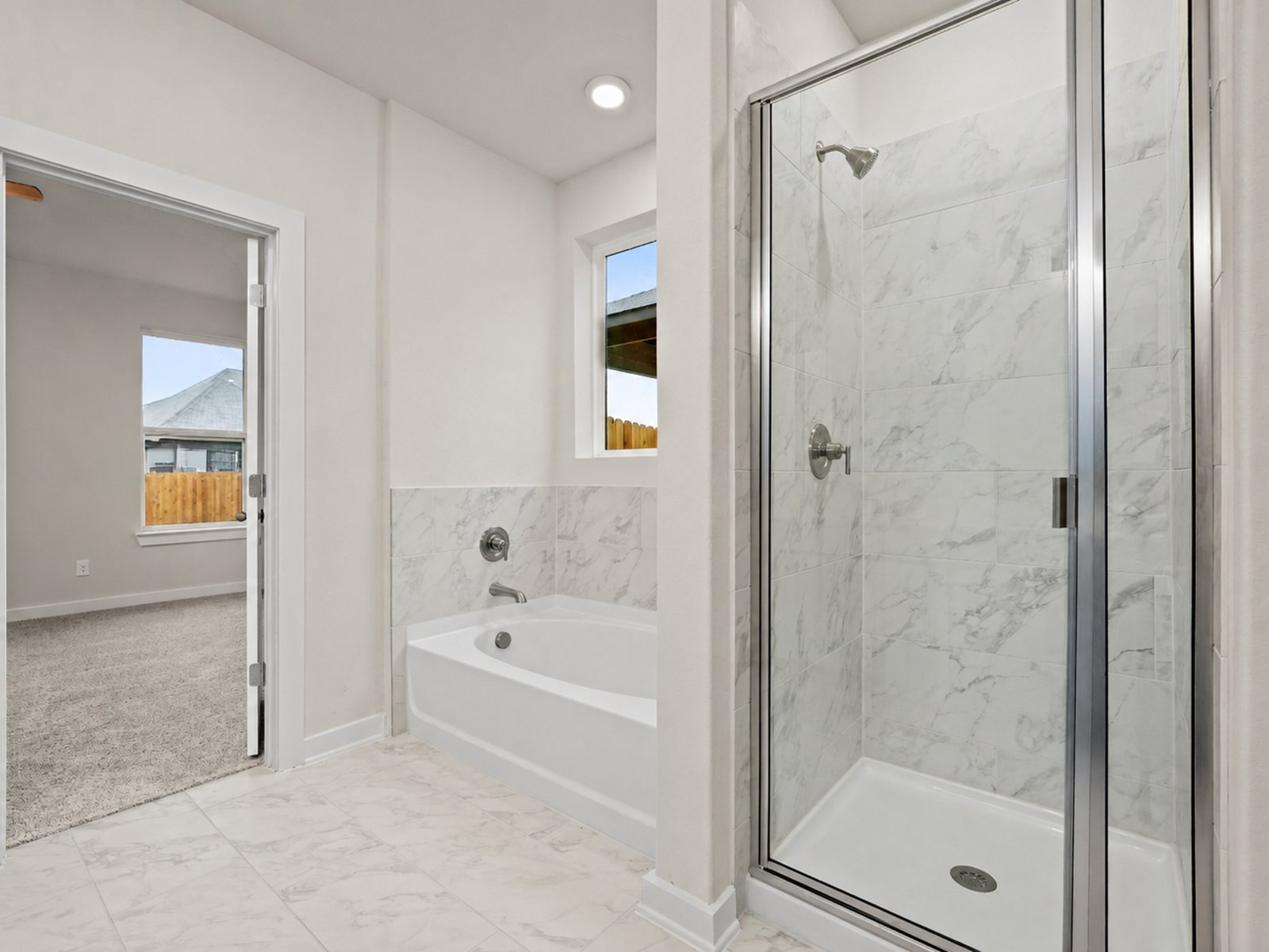 Primary bath with a soaking tub and walk-in shower
