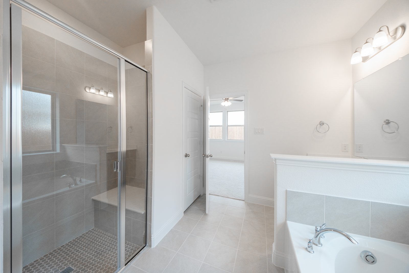 primary bathroom with soaking tub and walk-in shower