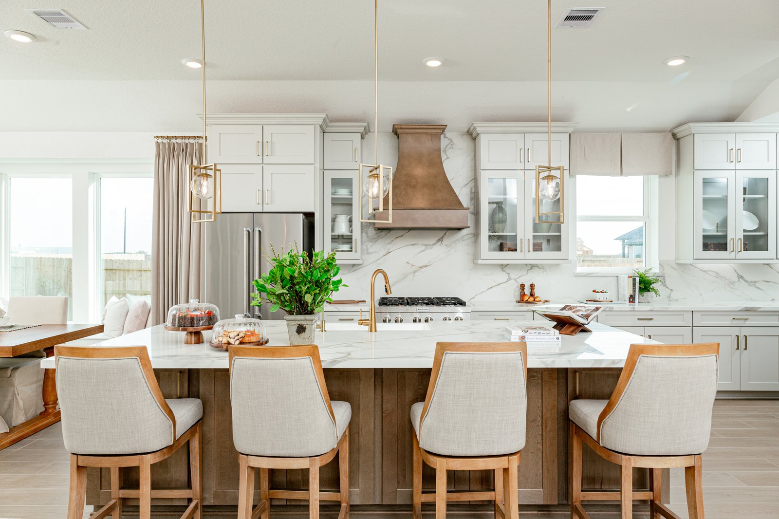 spacious kitchen with white cabinets