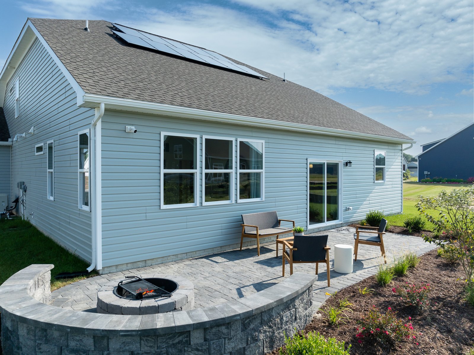 rear exterior with solar panels on the roof