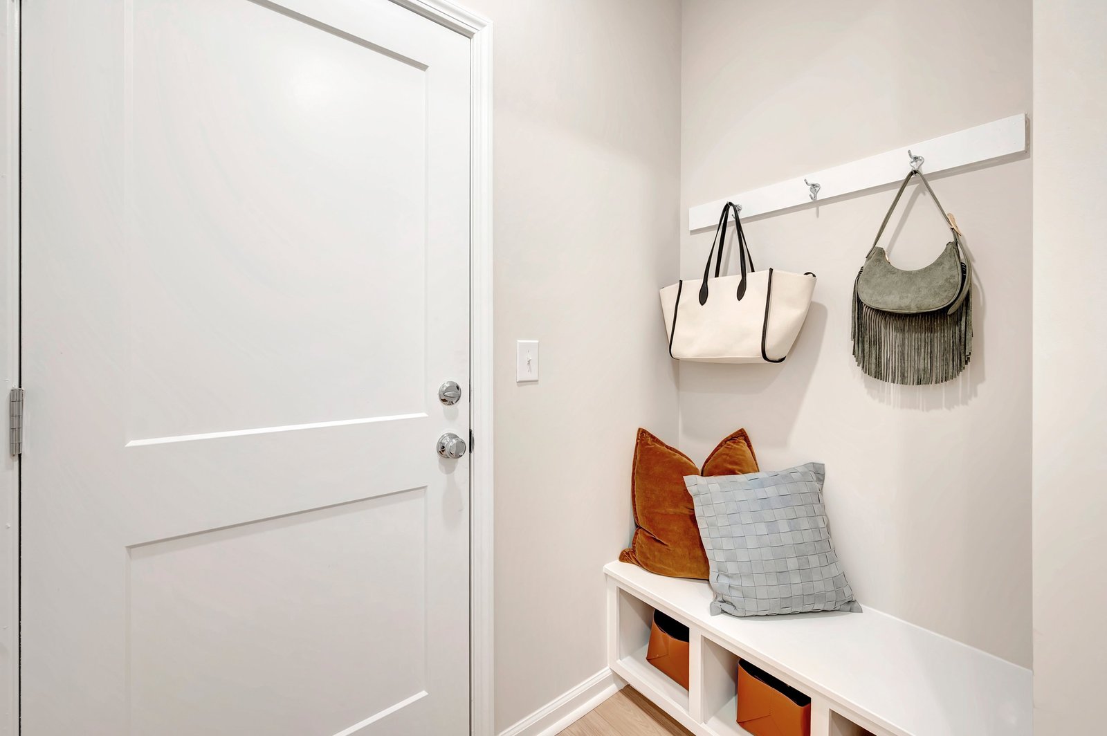mudroom with a bench and hooks