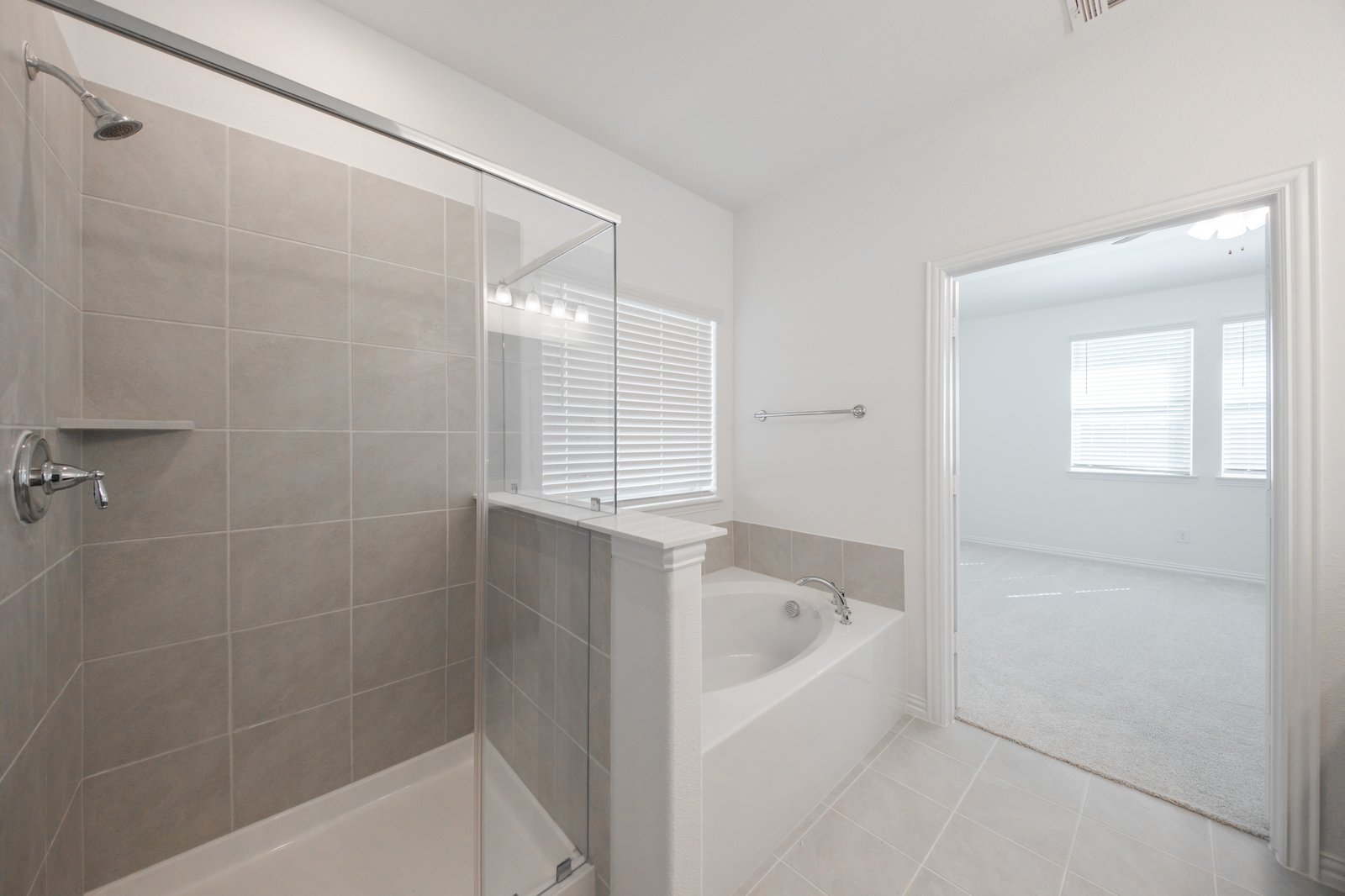 primary bathroom with soaking tub and walk-in shower