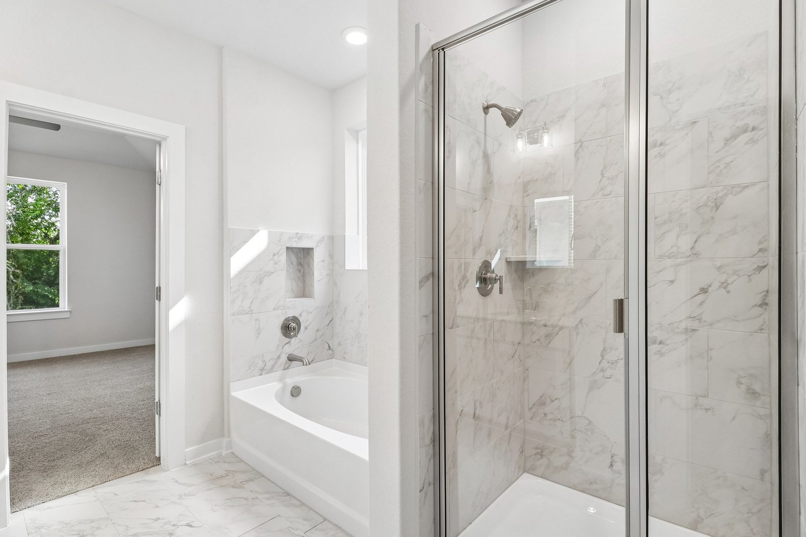 primary bath with walk-in shower and soaking tub