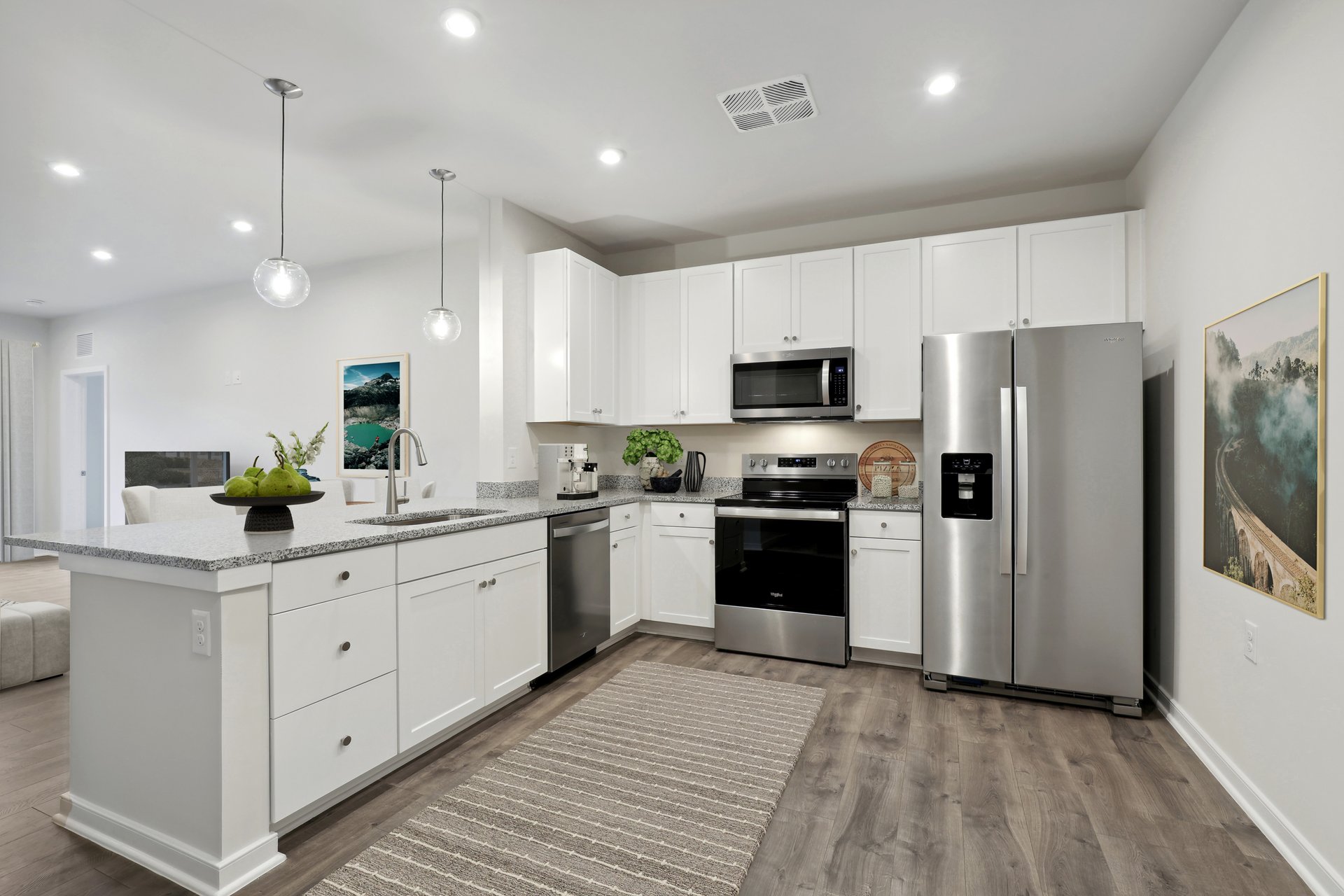kitchen with white cabinets and pendant lighting