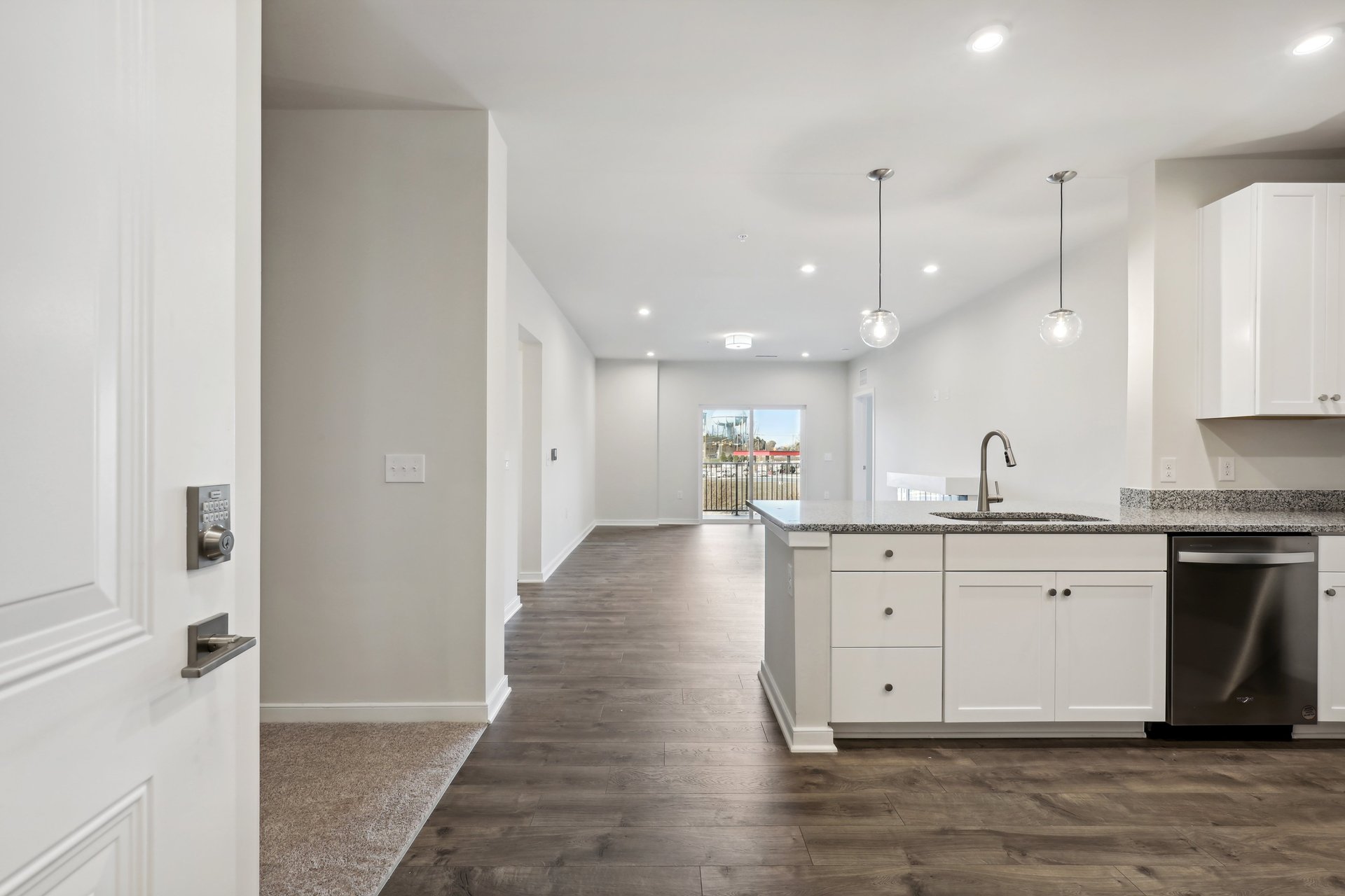 kitchen with quartz countertops and pendant lighting