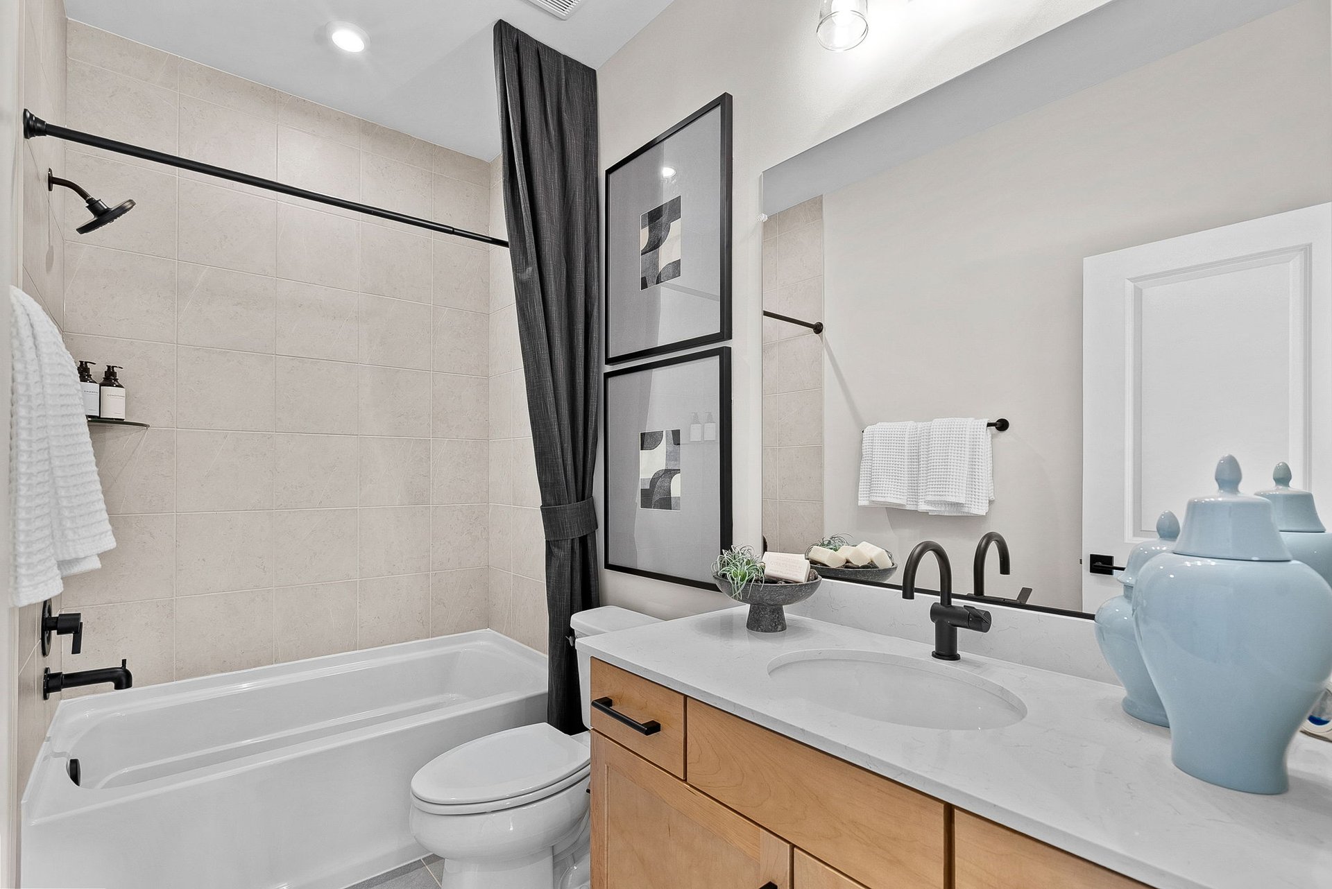 secondary bathroom with a shower & tub combo