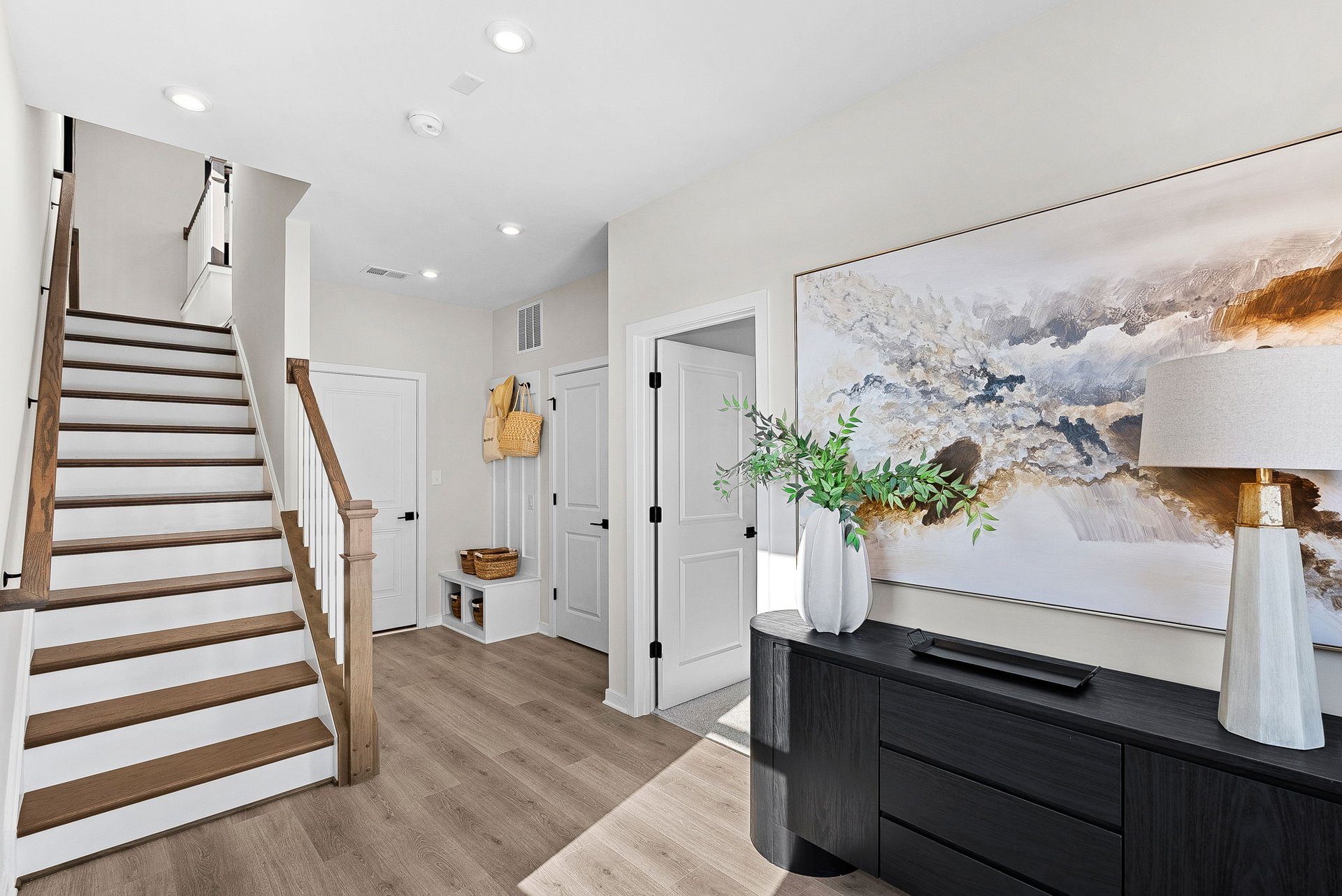 foyer with a front hall table and access to the garage
