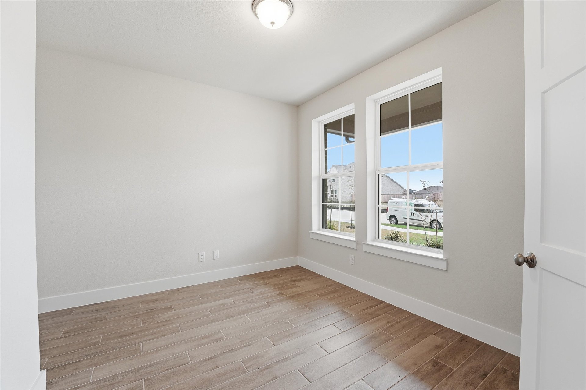 private study with hardwood flooring