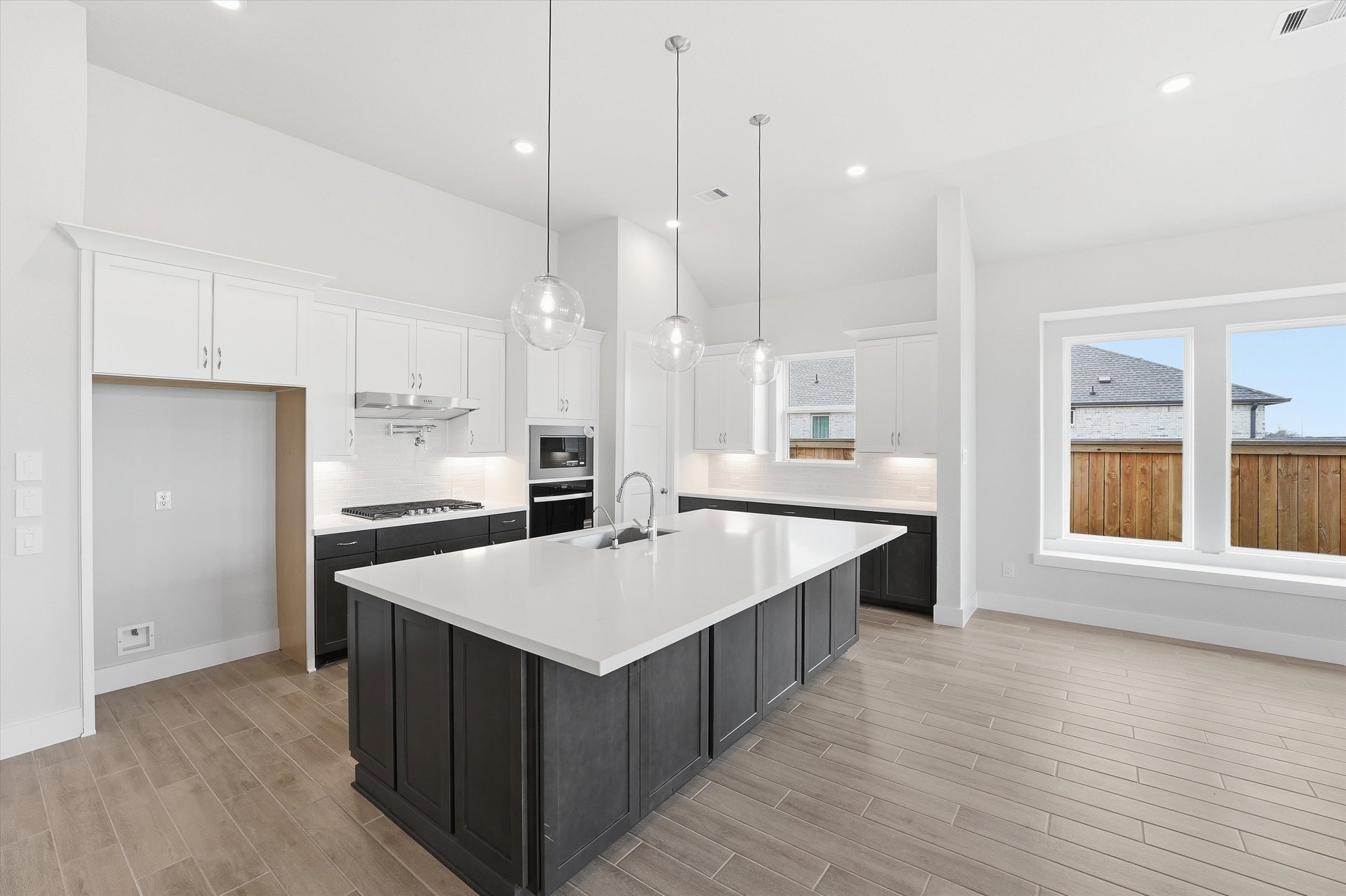 open kitchen with hardwood flooring