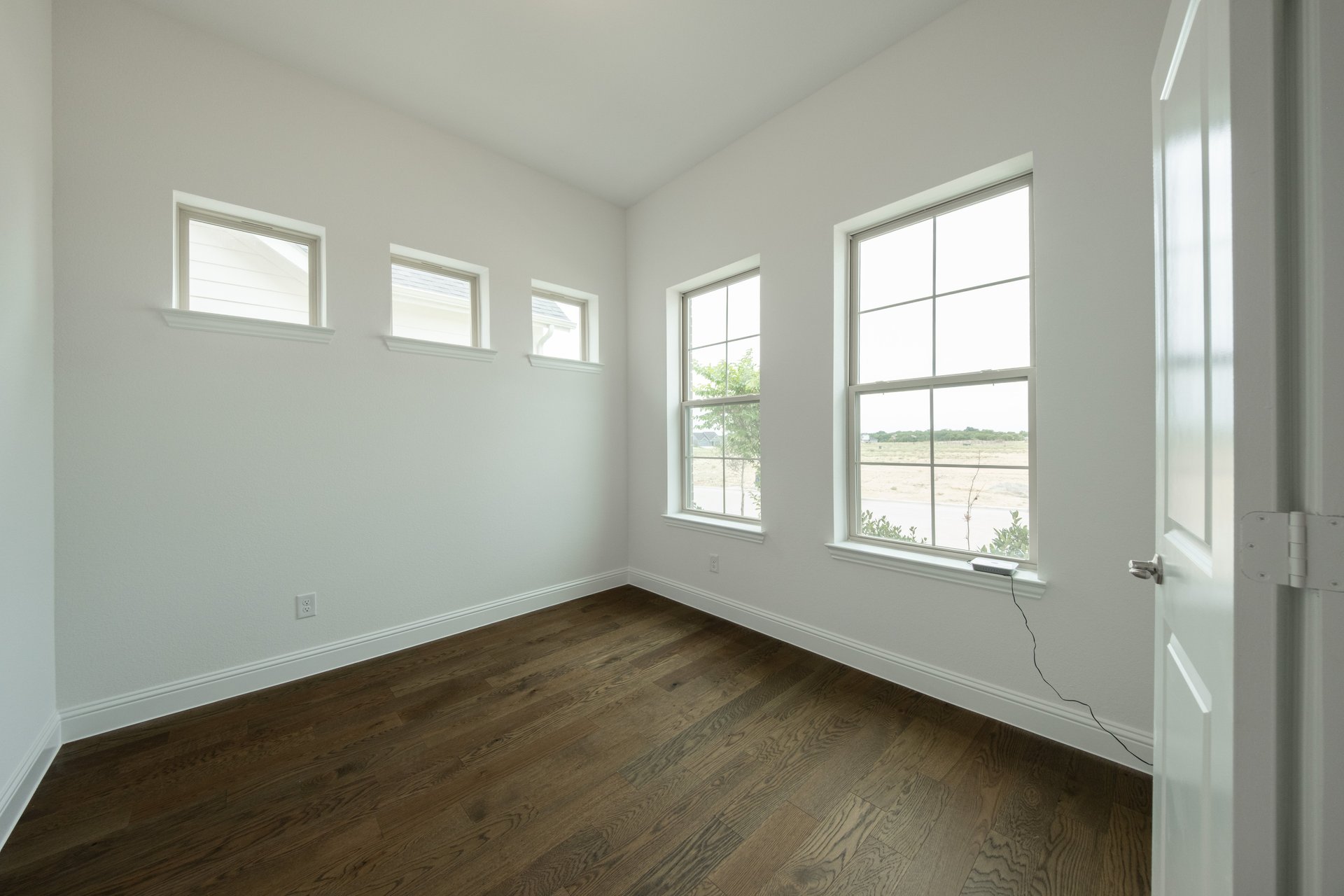 spacious dining room with hardwood flooring