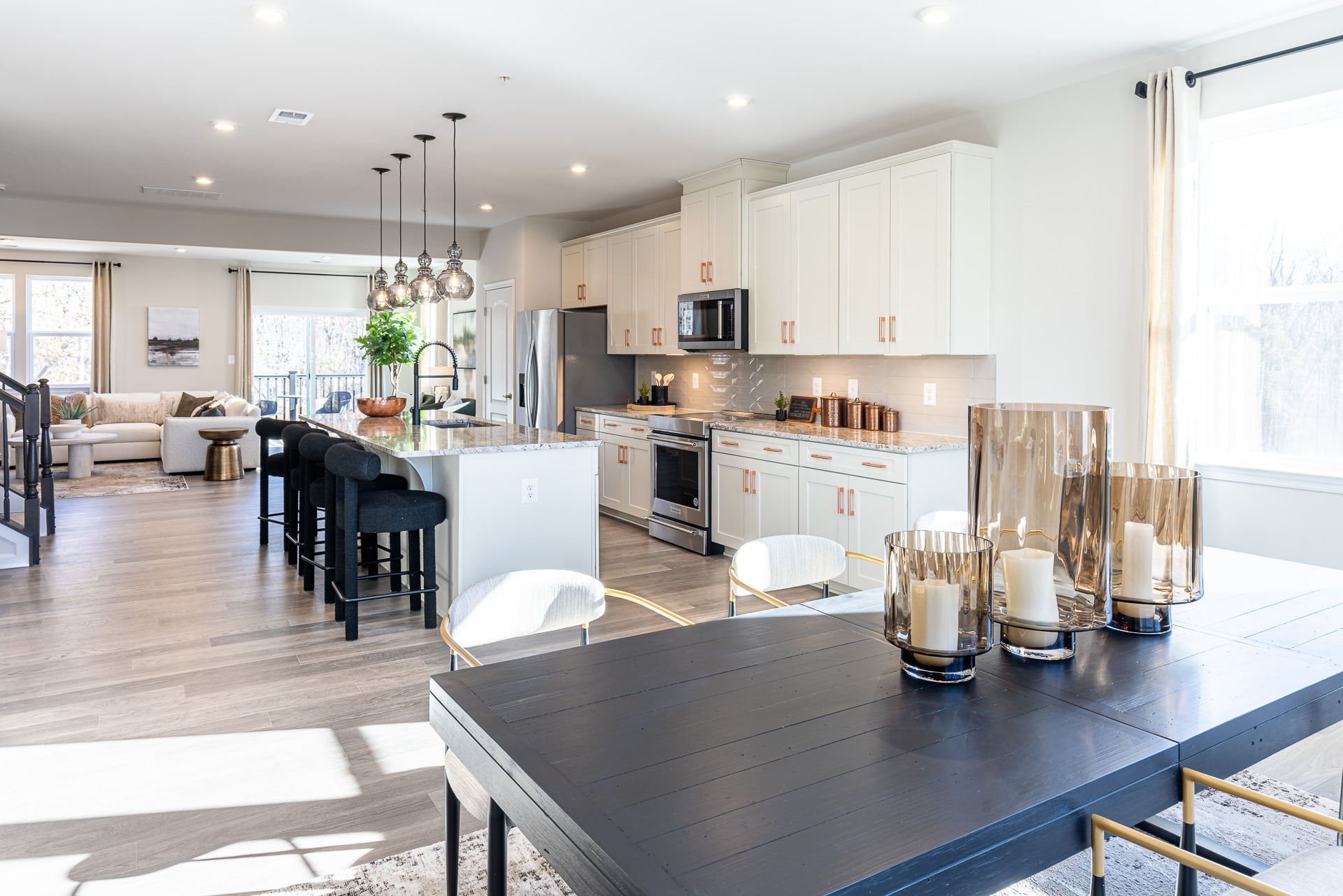 dining area with a large table extending to the kitchen