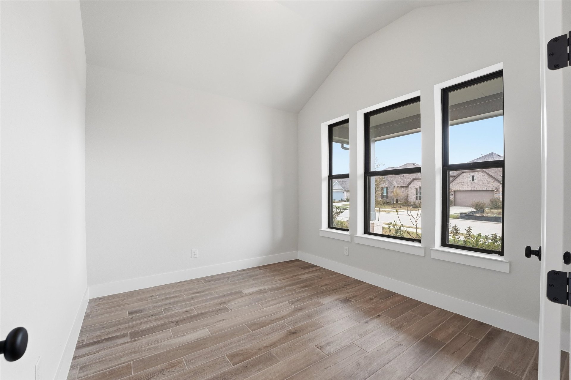 private study with hardwood flooring