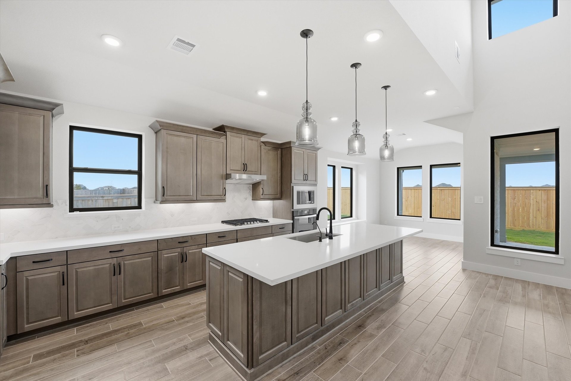 open kitchen with brown cabinets