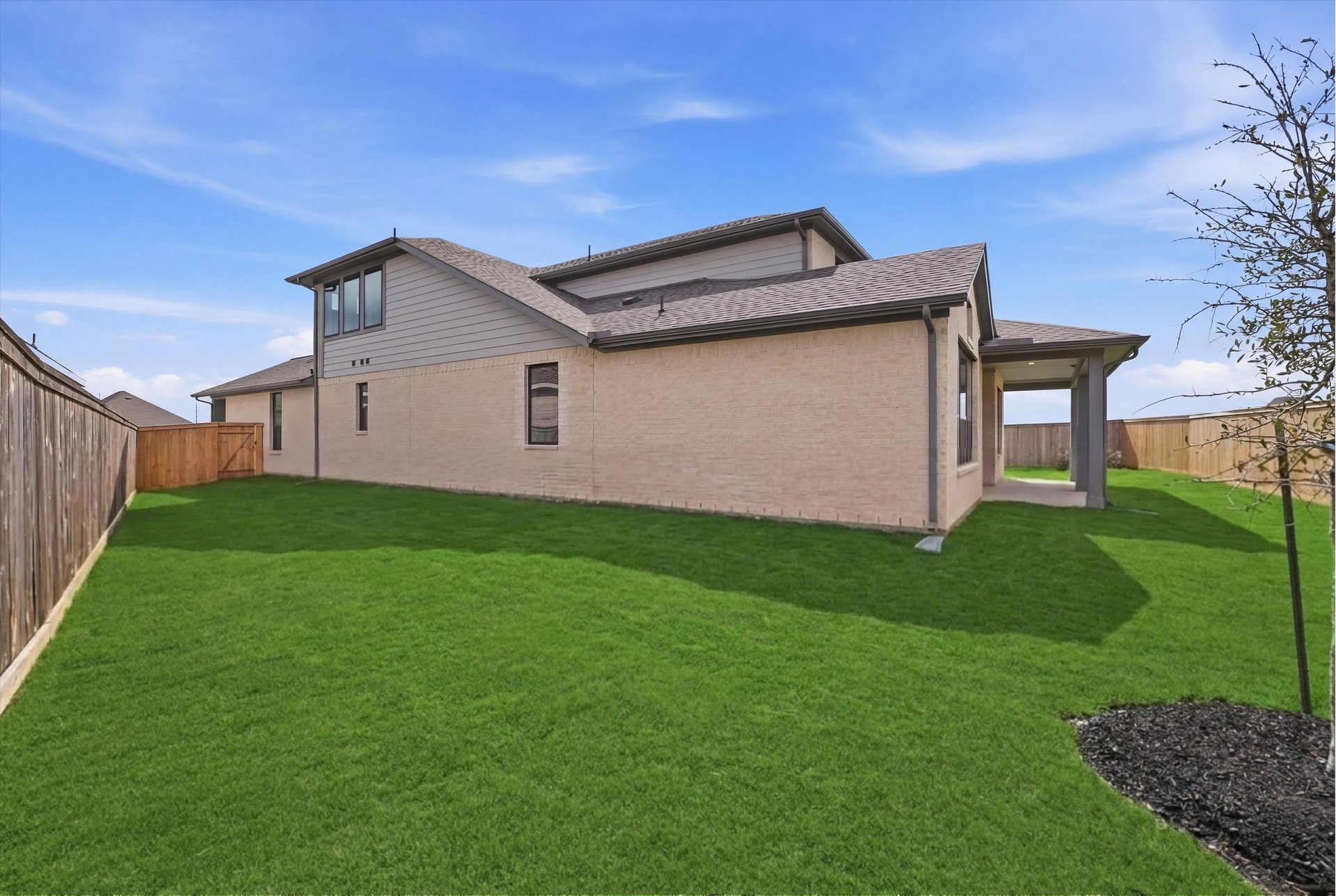 spacious backyard with covered patio