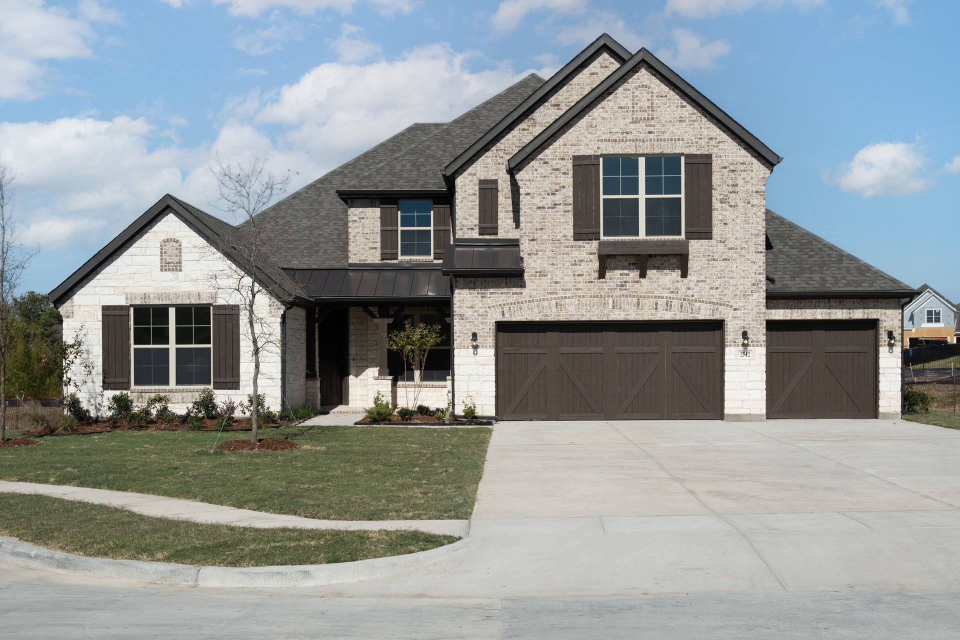 home exterior with brick and stone