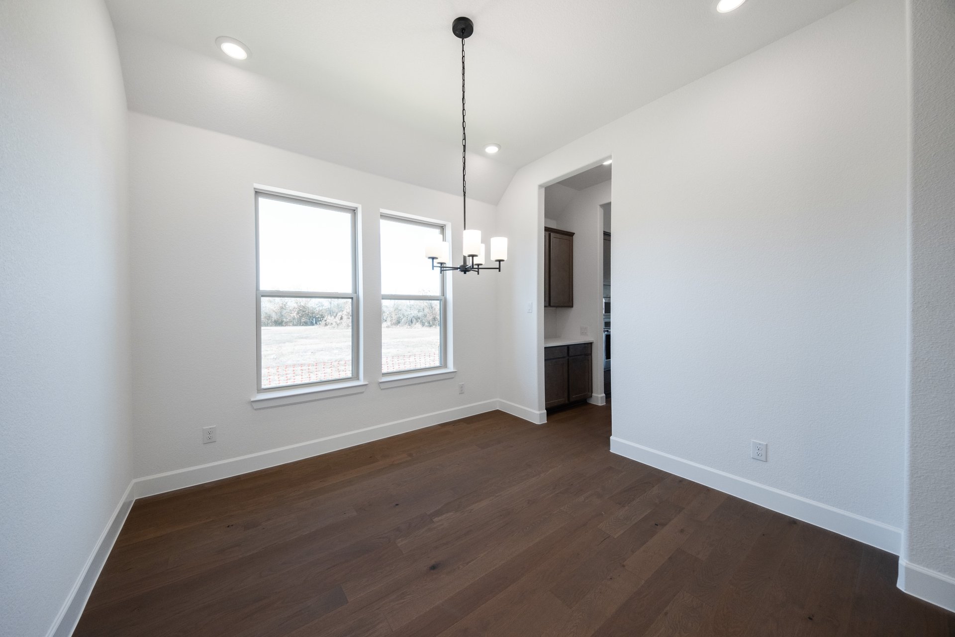 dining room with wood flooring and chandelier