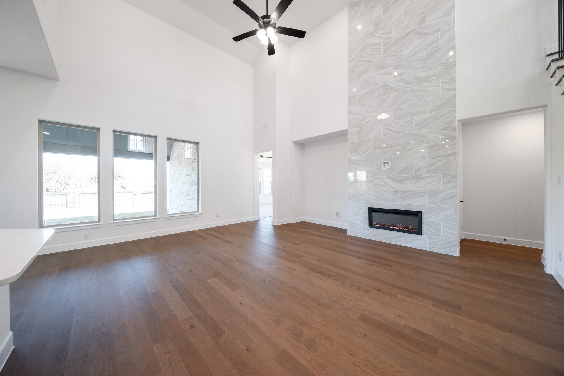 great room with high ceilings and fireplace