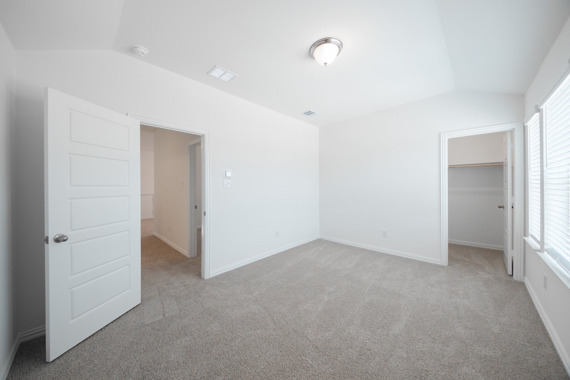 guest bedroom with carpet