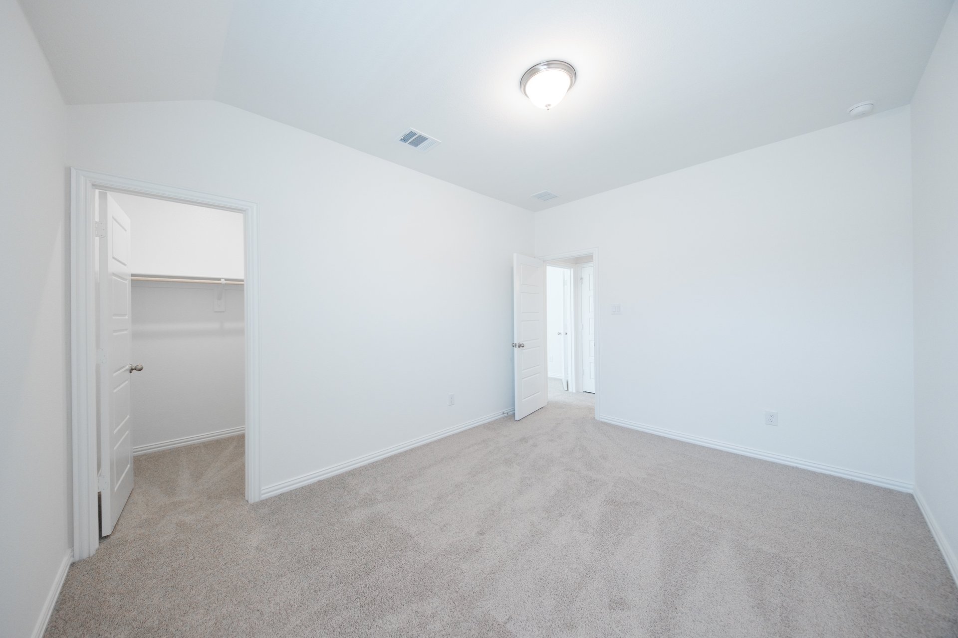 guest bedroom with carpet