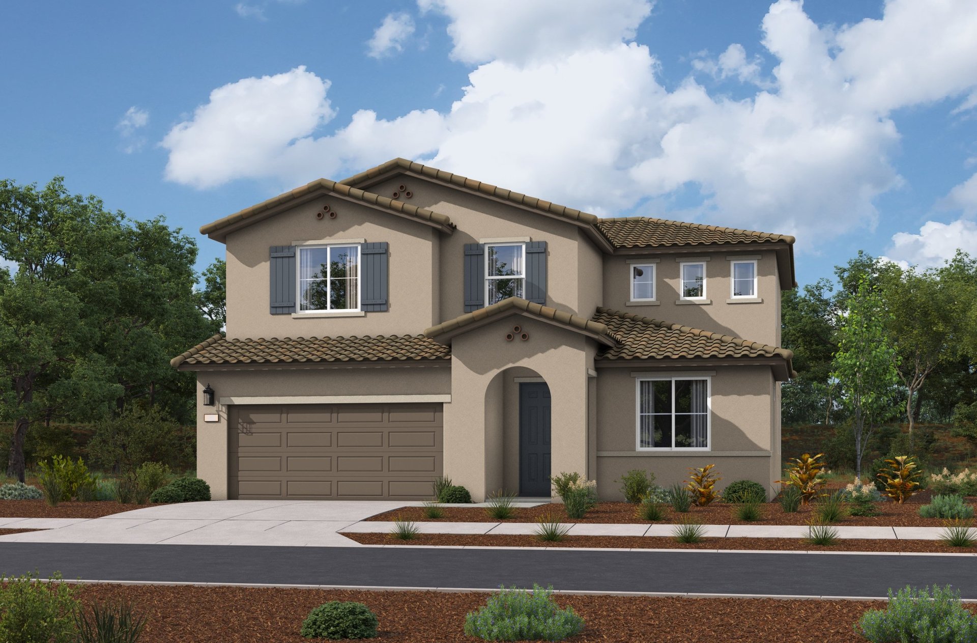 exterior of two-story home with desert landscaping and brown garage