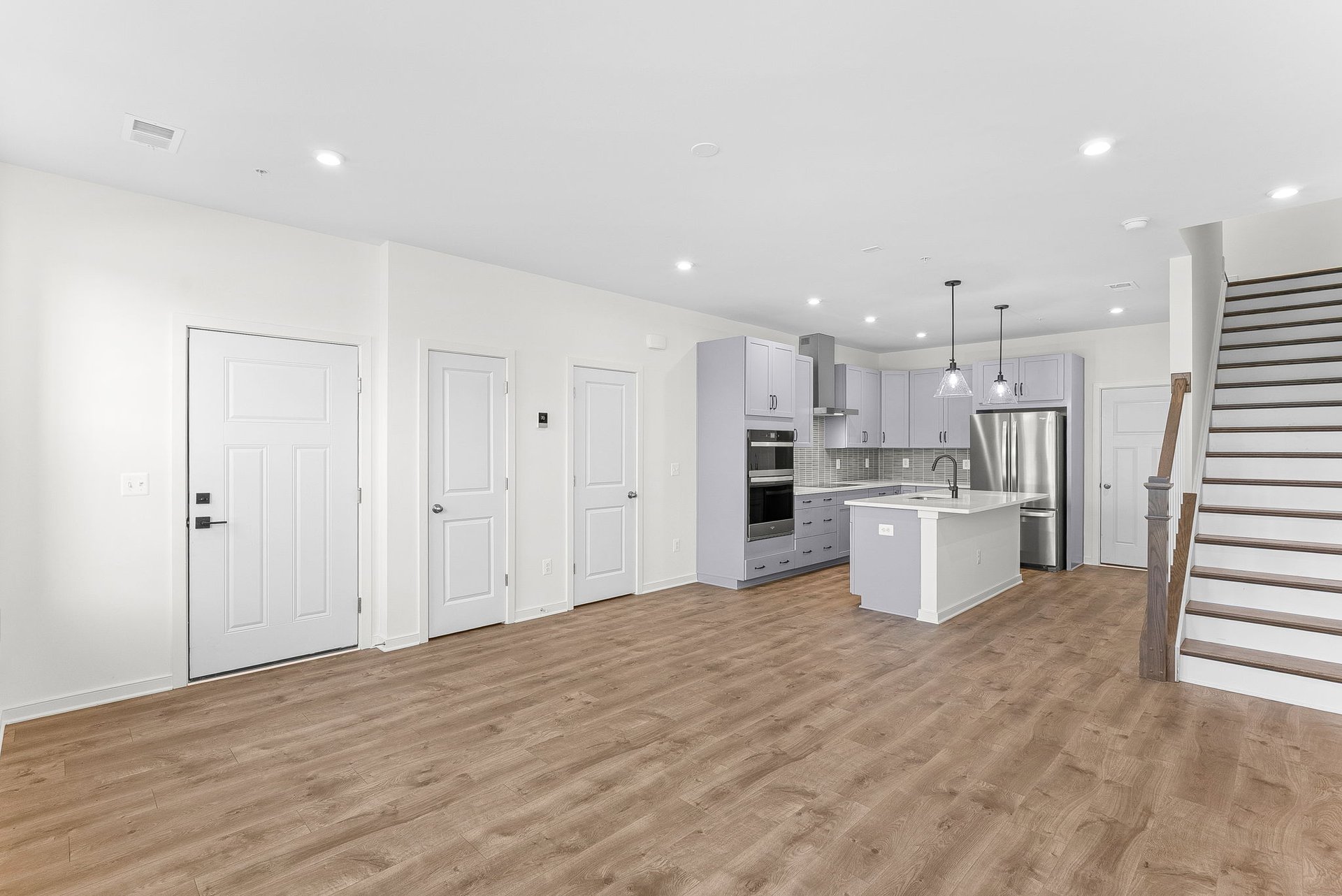 great room with windows and hardwood floors