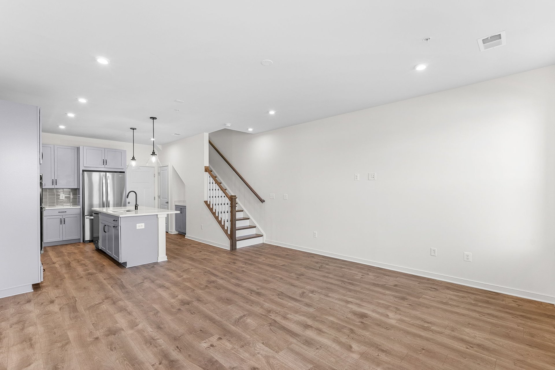 great room with windows and hardwood floors