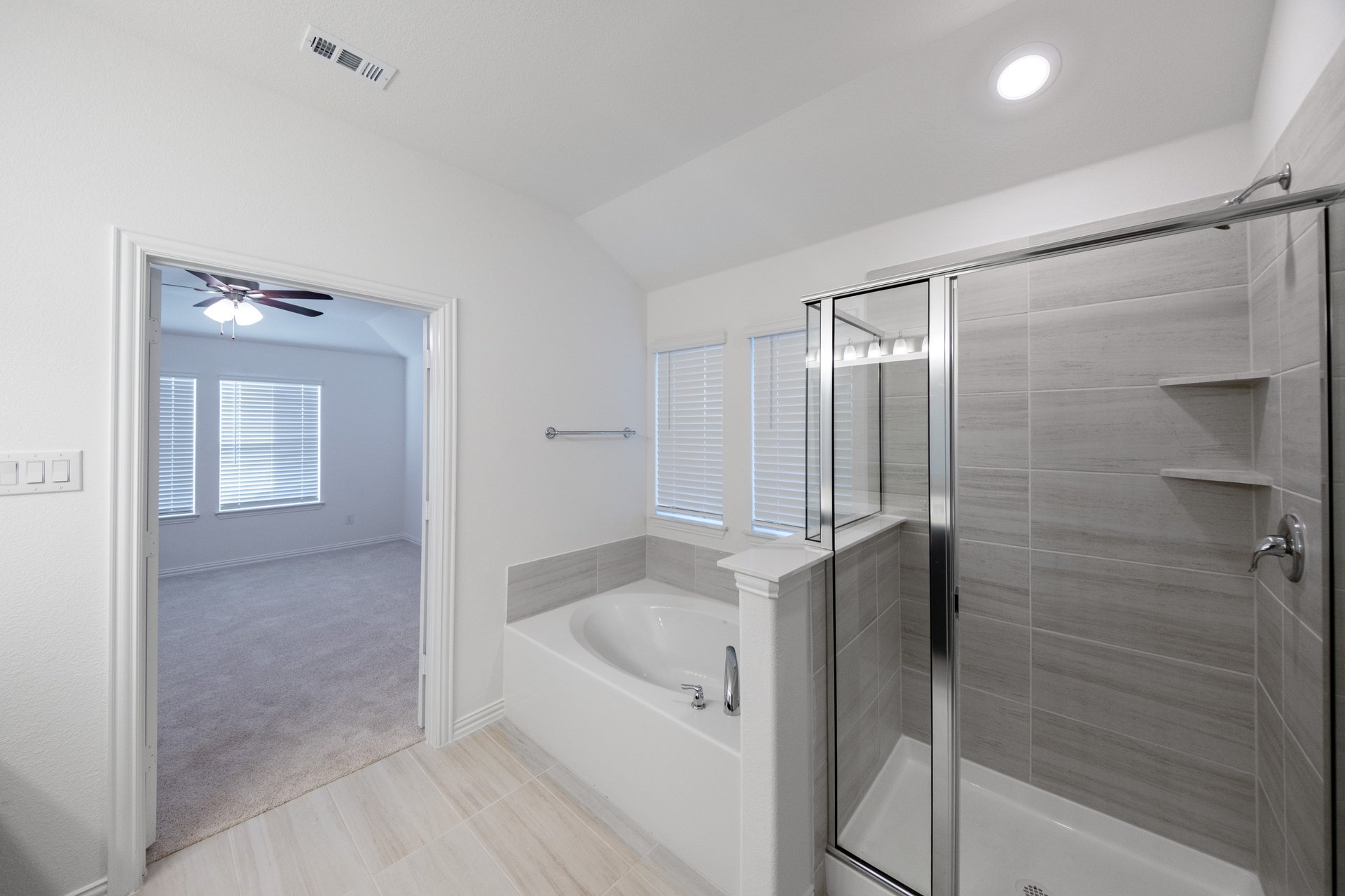 primary bathroom with soaking tub and walk-in shower