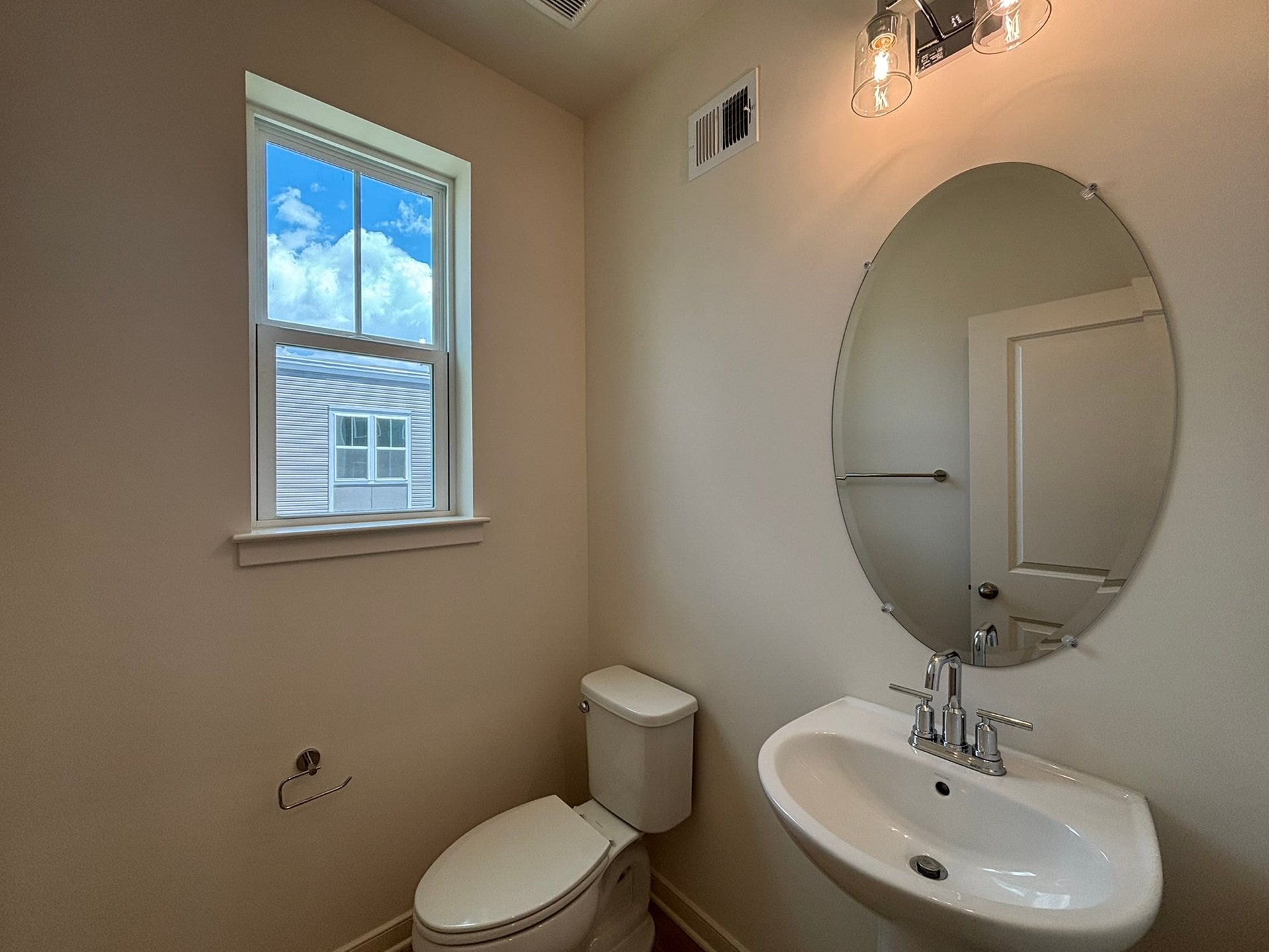powder room with a pedestal sink