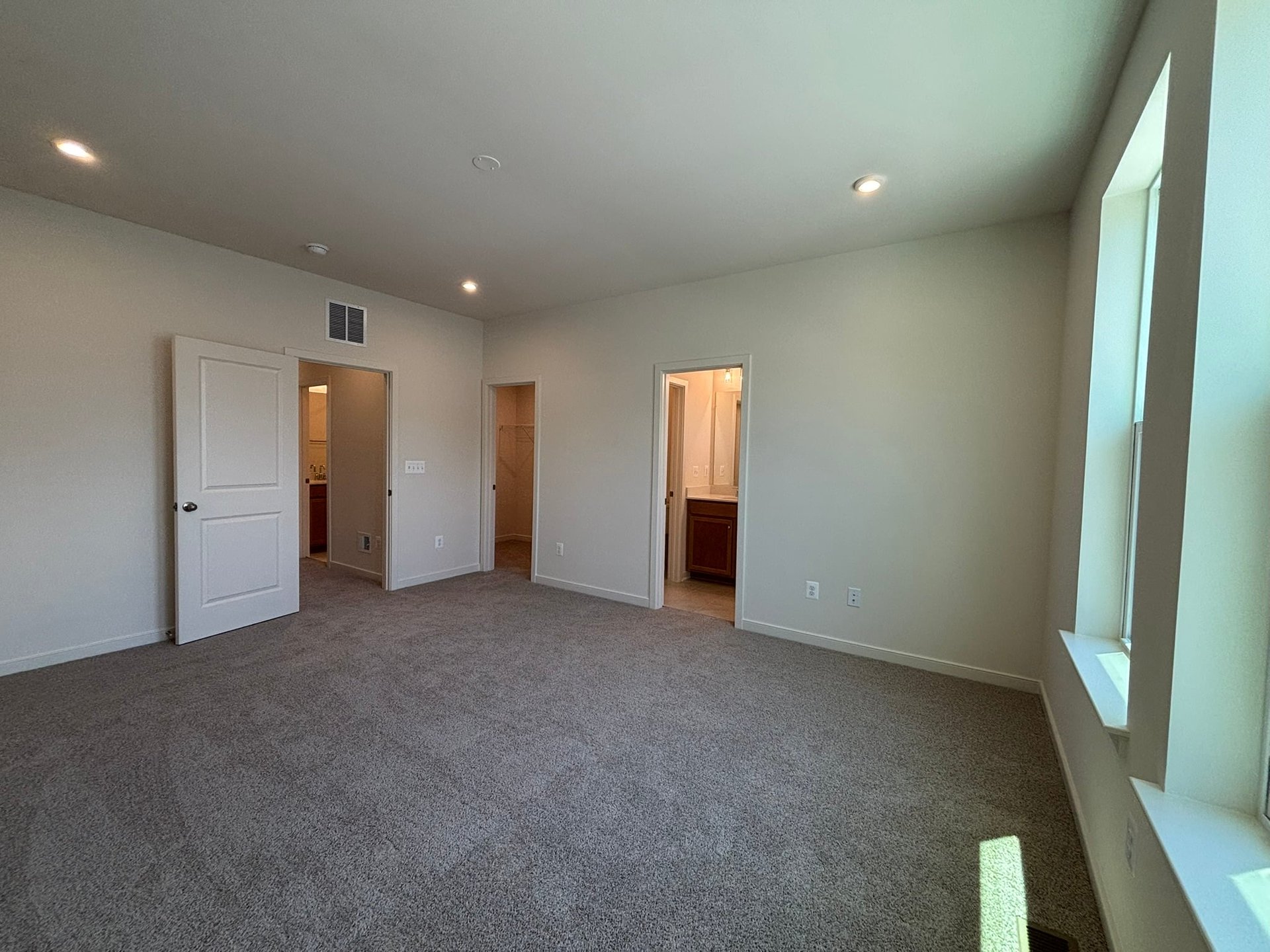 primary bedroom with carpet