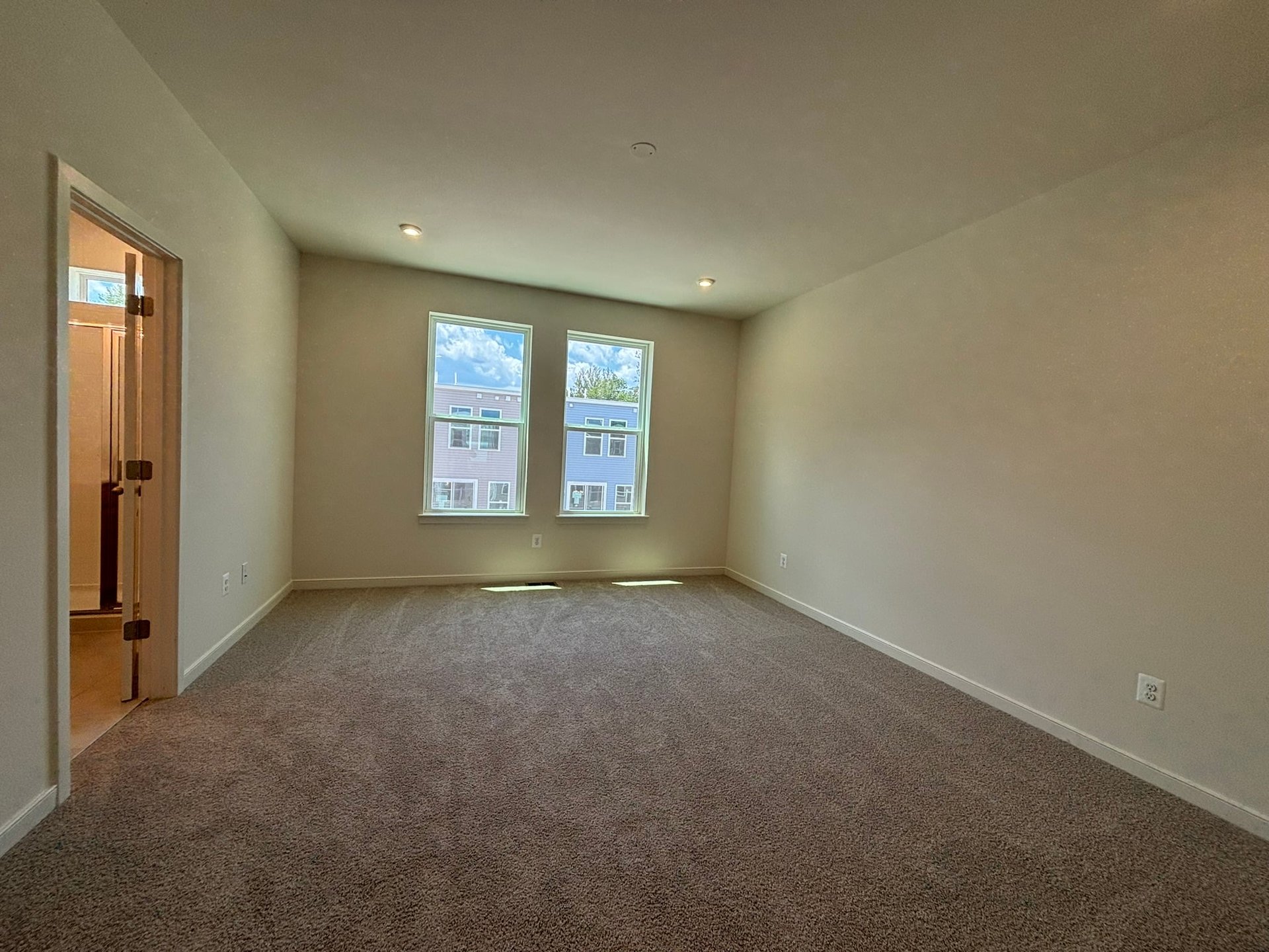 primary bedroom with two windows
