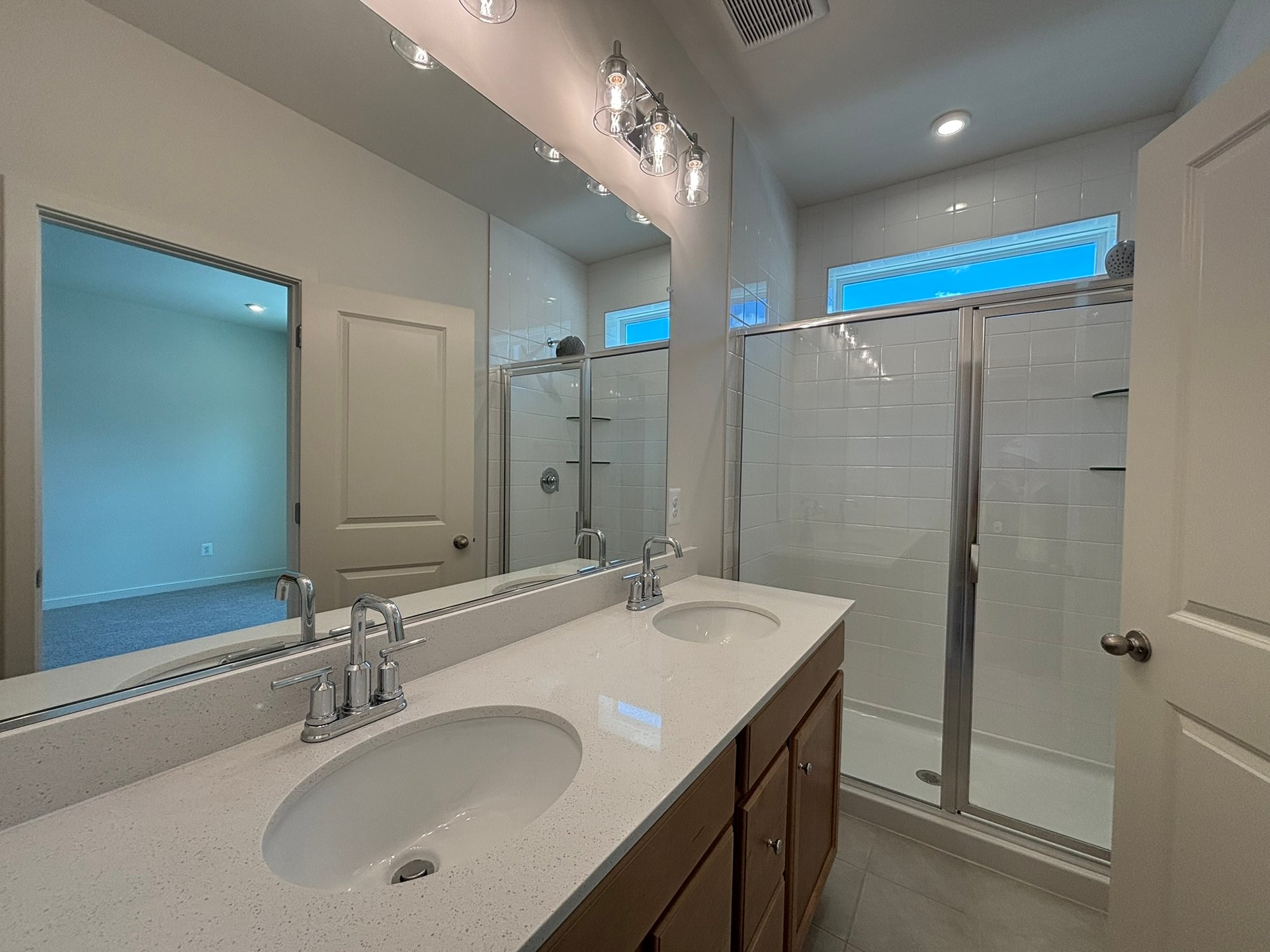 primary bathroom with an oversized shower with a window