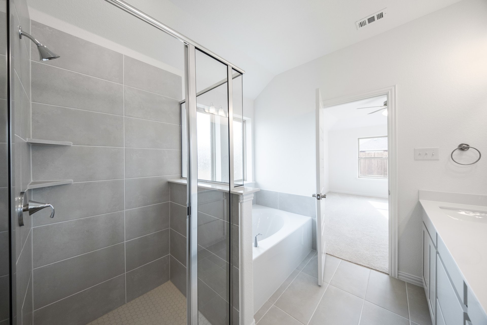 primary bathroom with soaking tub and walk-in shower