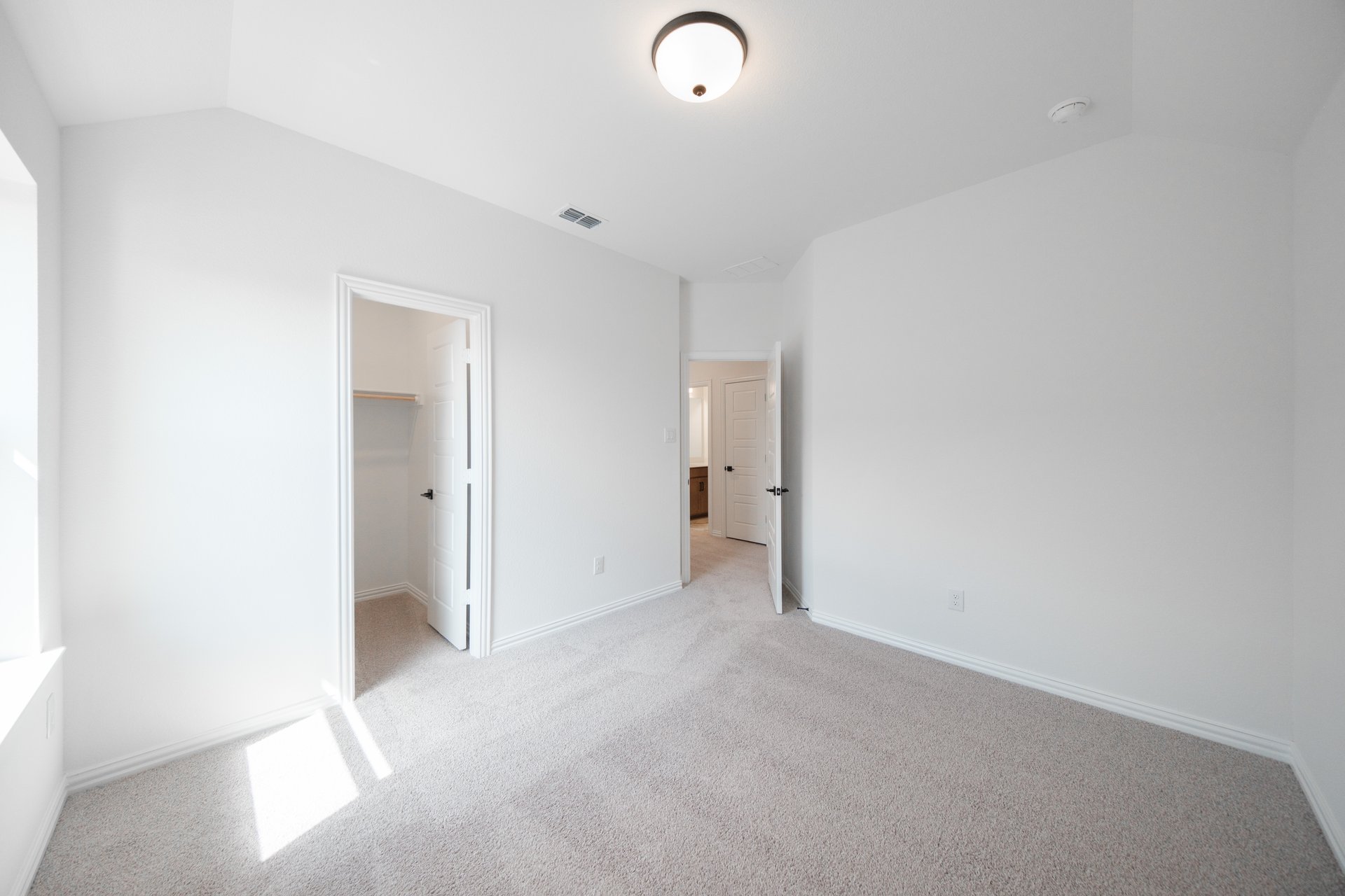 guest bedroom with carpet