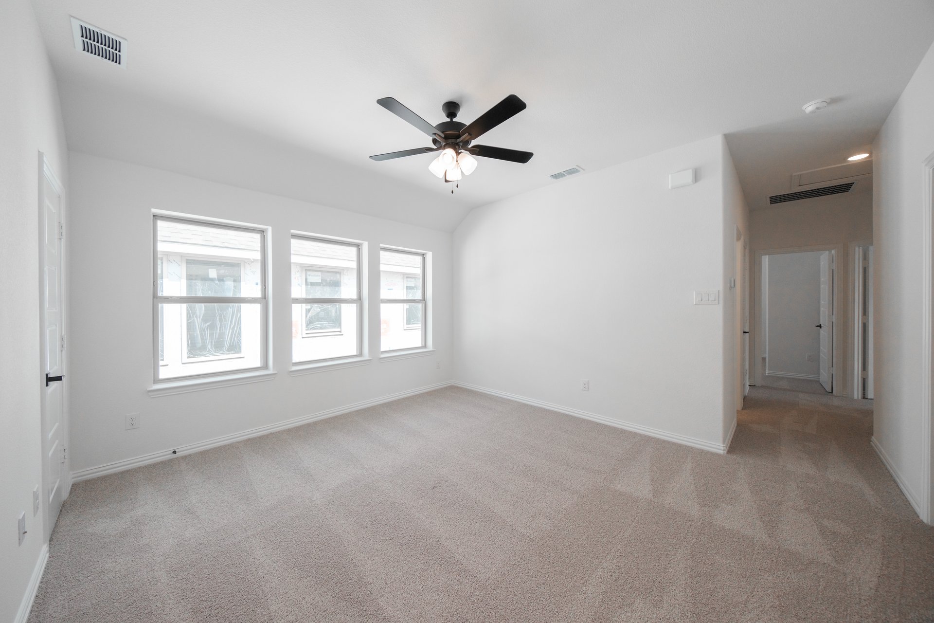 spacious game room with carpet
